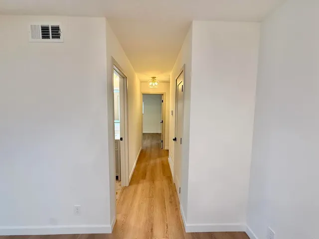 a view of a bathroom with a sink and a mirror