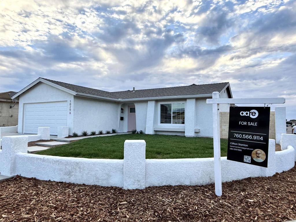 10296 Baroness Avenue San Diego, CA 92126 - Photo 2 of 27 a front view of house with yard and green space