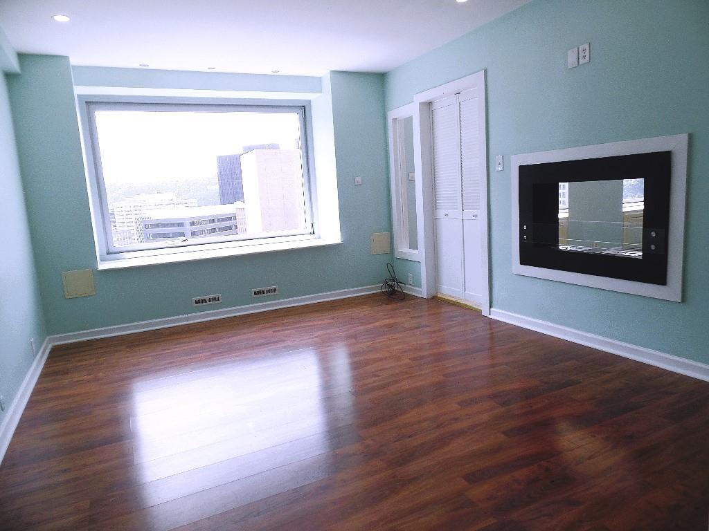 320 Fort Duquesne Boulevard, Unit 24M Pittsburgh, PA 15222 - Photo 5 of 40 a view of empty room with wooden floor and fan
