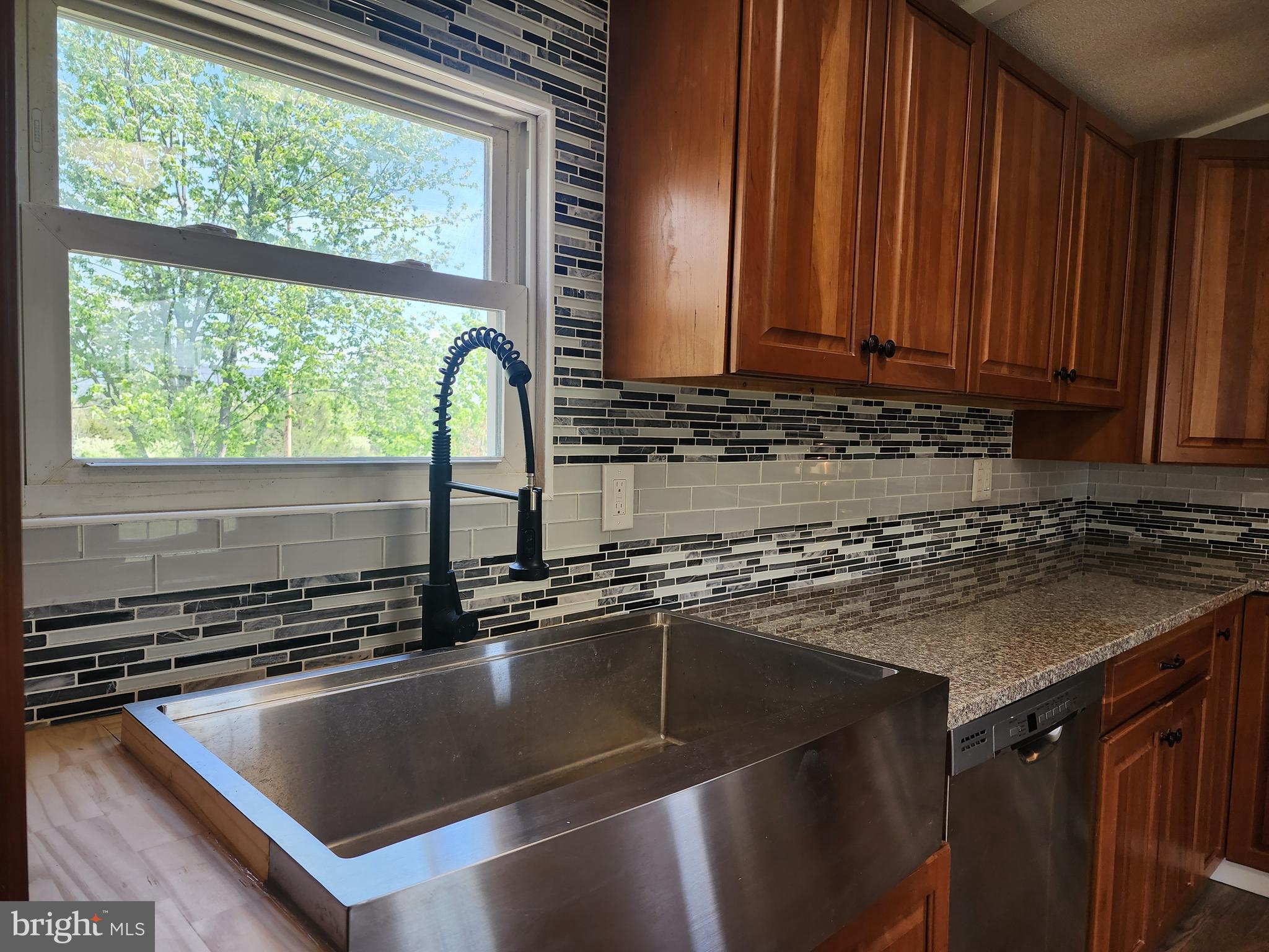 41 Mountain View Terrace Newville, PA 17241 - Photo 10 of 34 a kitchen with granite countertop a sink and a stove
