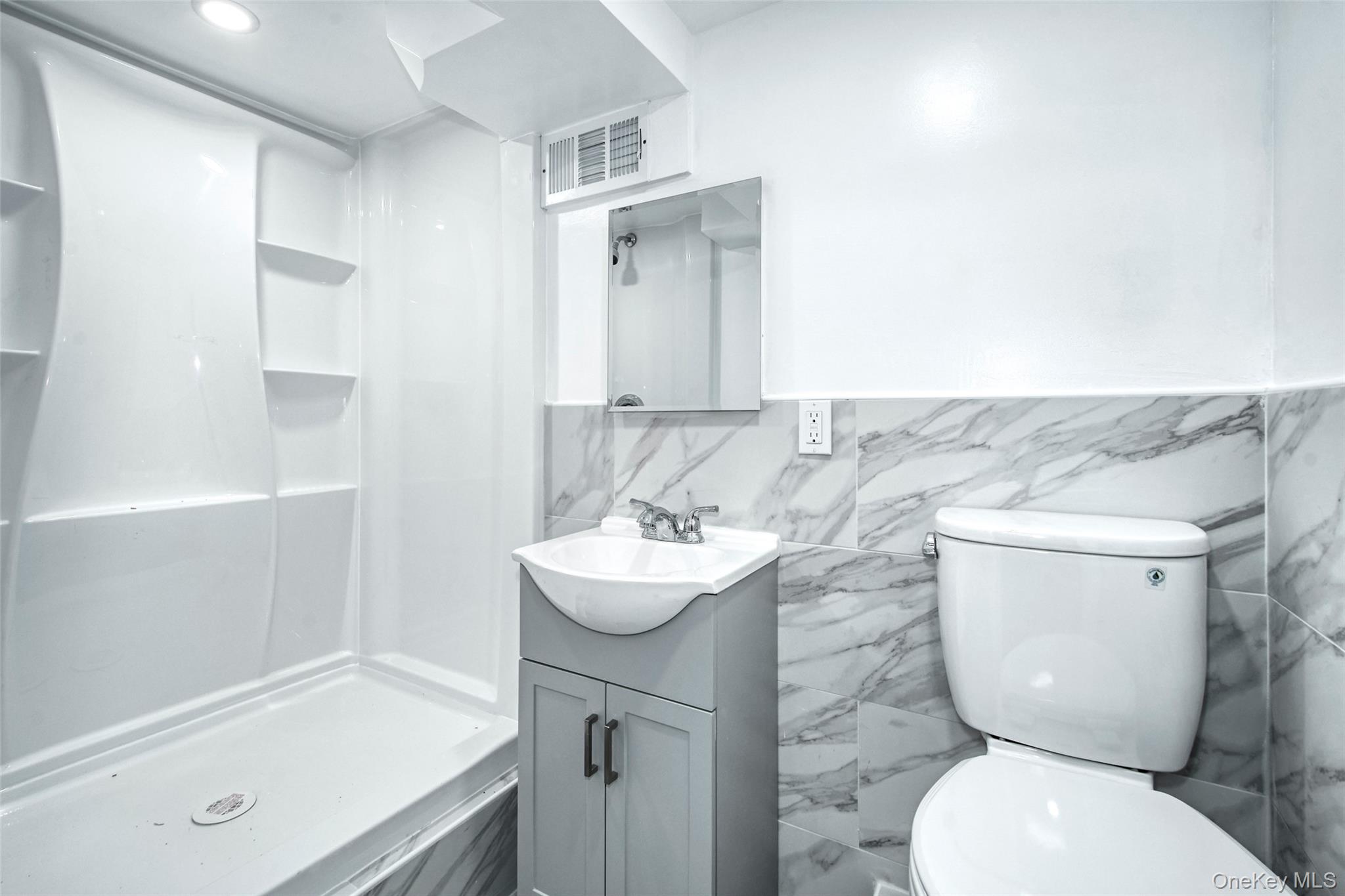 415 Pinebrook Boulevard New Rochelle, NY 10804 - Photo 12 of 20 a bathroom with a sink toilet and shower