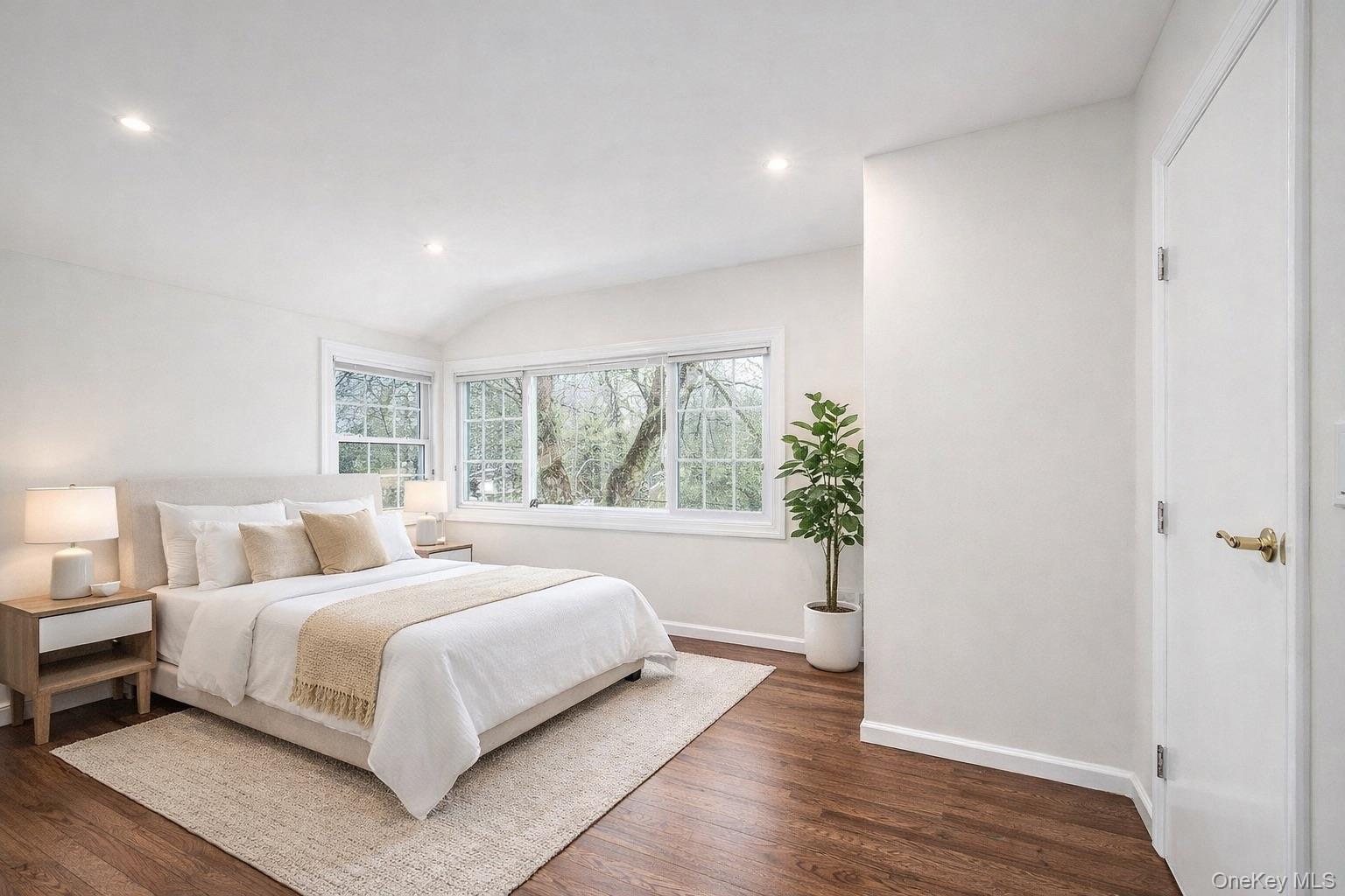 415 Pinebrook Boulevard New Rochelle, NY 10804 - Photo 13 of 20 a bedroom with a large bed and a potted plant