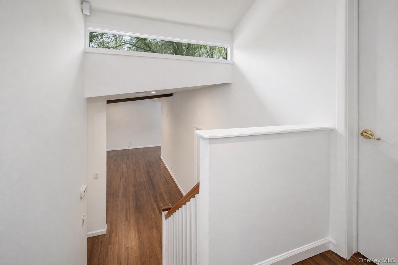 415 Pinebrook Boulevard New Rochelle, NY 10804 - Photo 15 of 20 a view of staircase with wooden floor