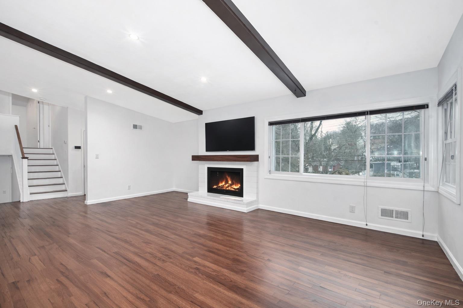415 Pinebrook Boulevard New Rochelle, NY 10804 - Photo 16 of 20 a view of an empty room with wooden floor and a window