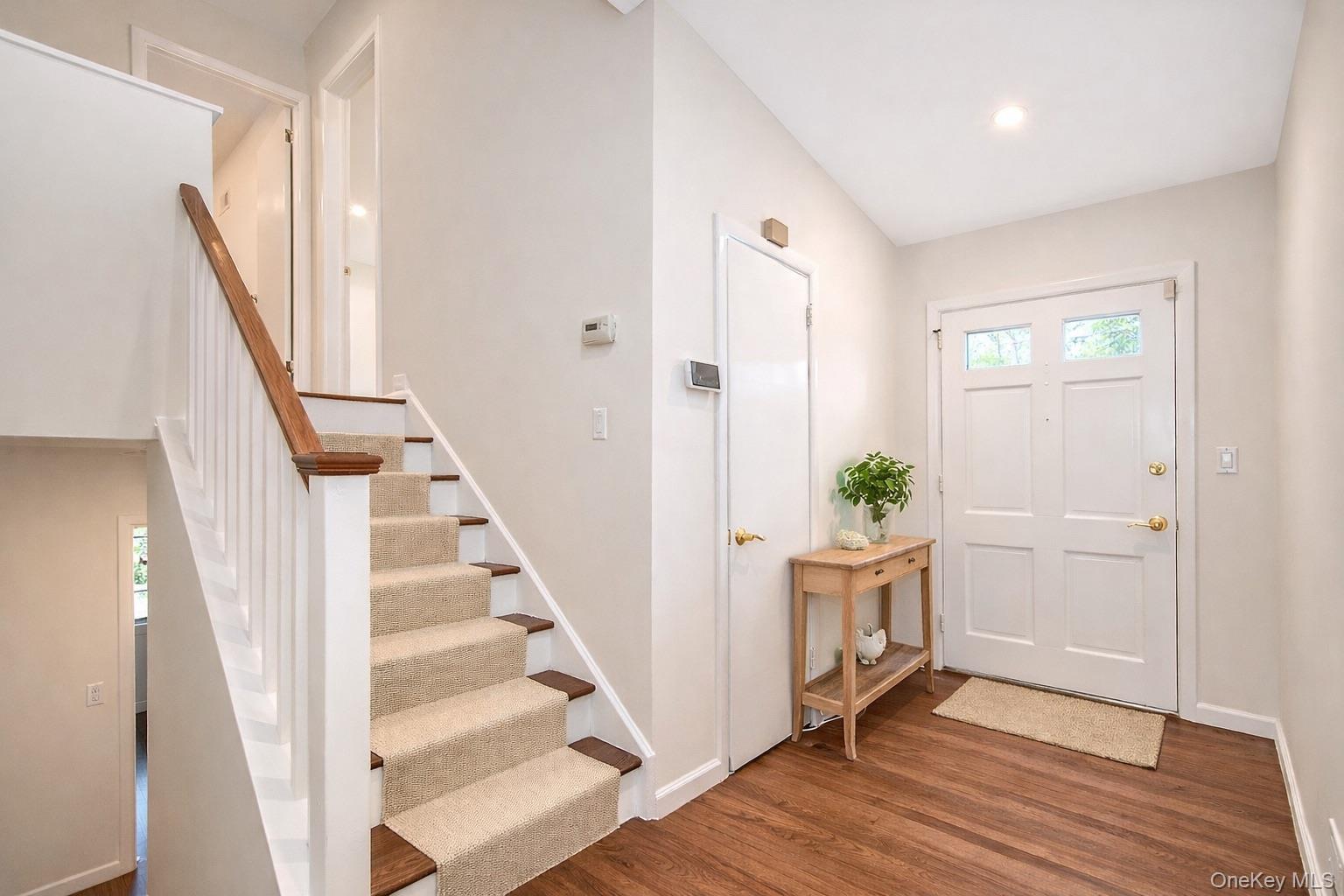 415 Pinebrook Boulevard New Rochelle, NY 10804 - Photo 17 of 20 a view of a hallway with wooden floor and entryway
