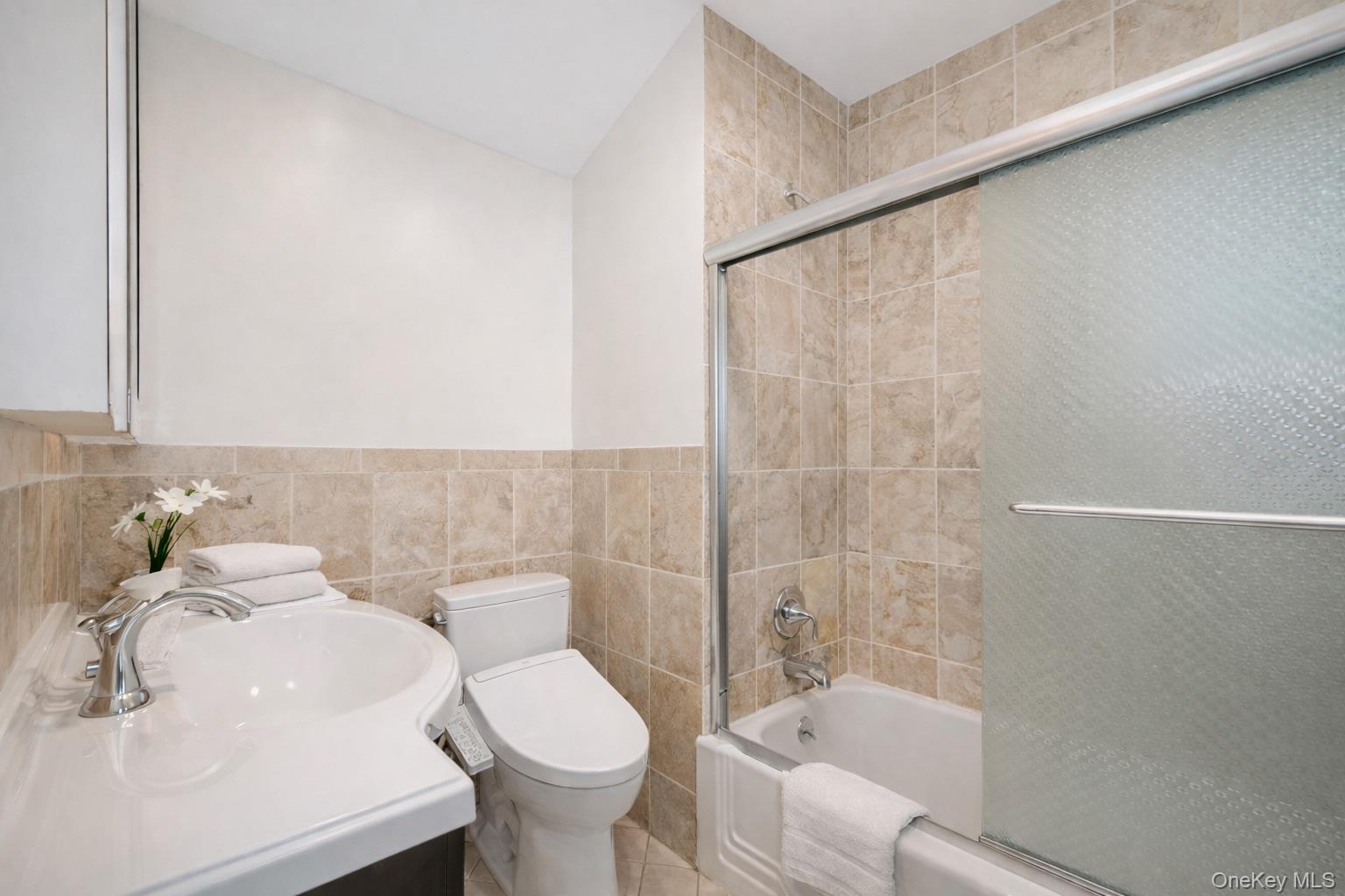 415 Pinebrook Boulevard New Rochelle, NY 10804 - Photo 18 of 20 a bathroom with a sink toilet and shower