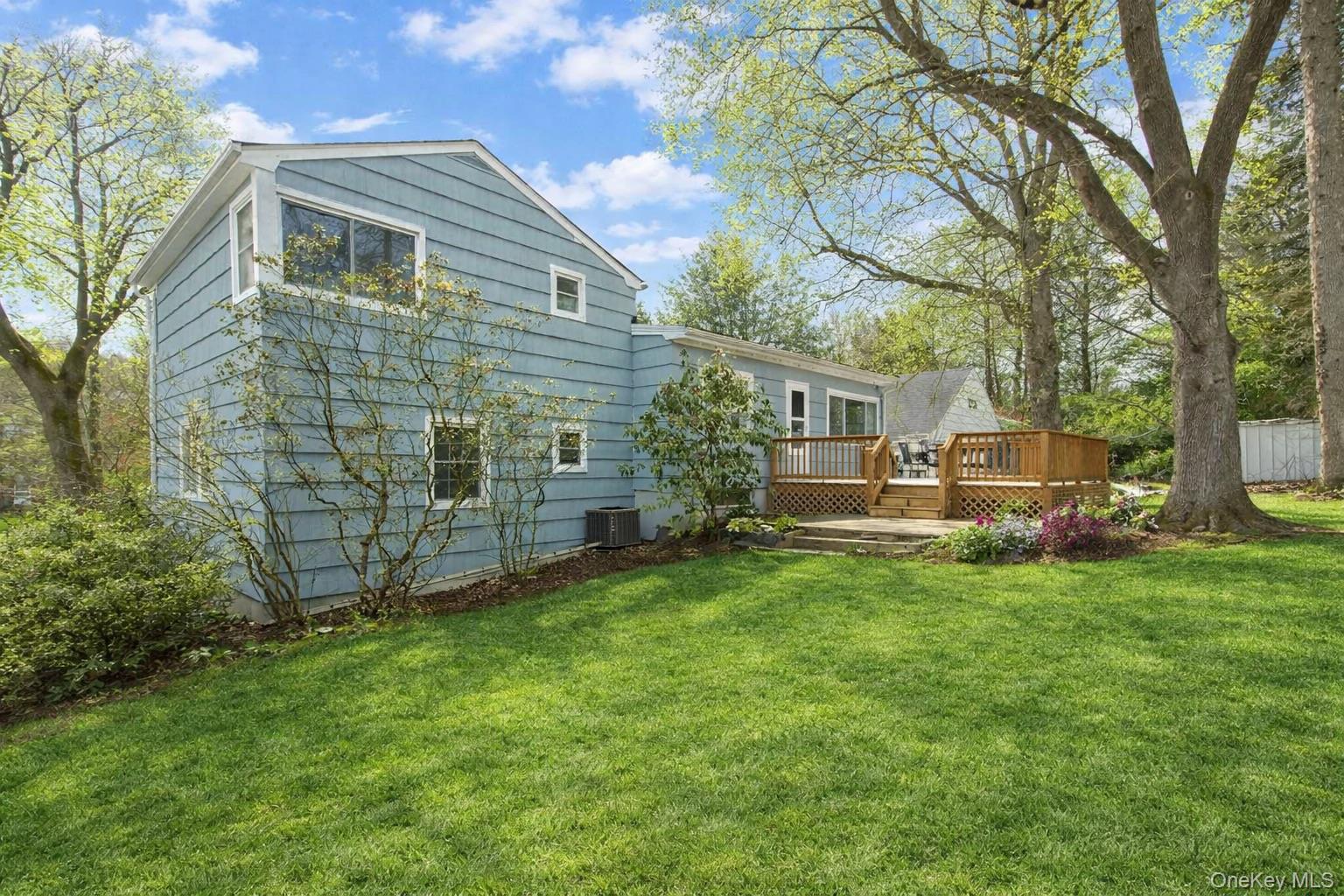 415 Pinebrook Boulevard New Rochelle, NY 10804 - Photo 2 of 20 a front view of a house with a garden