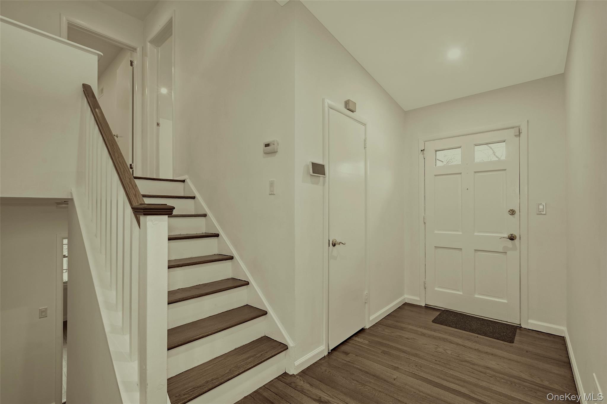 415 Pinebrook Boulevard New Rochelle, NY 10804 - Photo 3 of 20 a view of a hallway with wooden floor and entryway