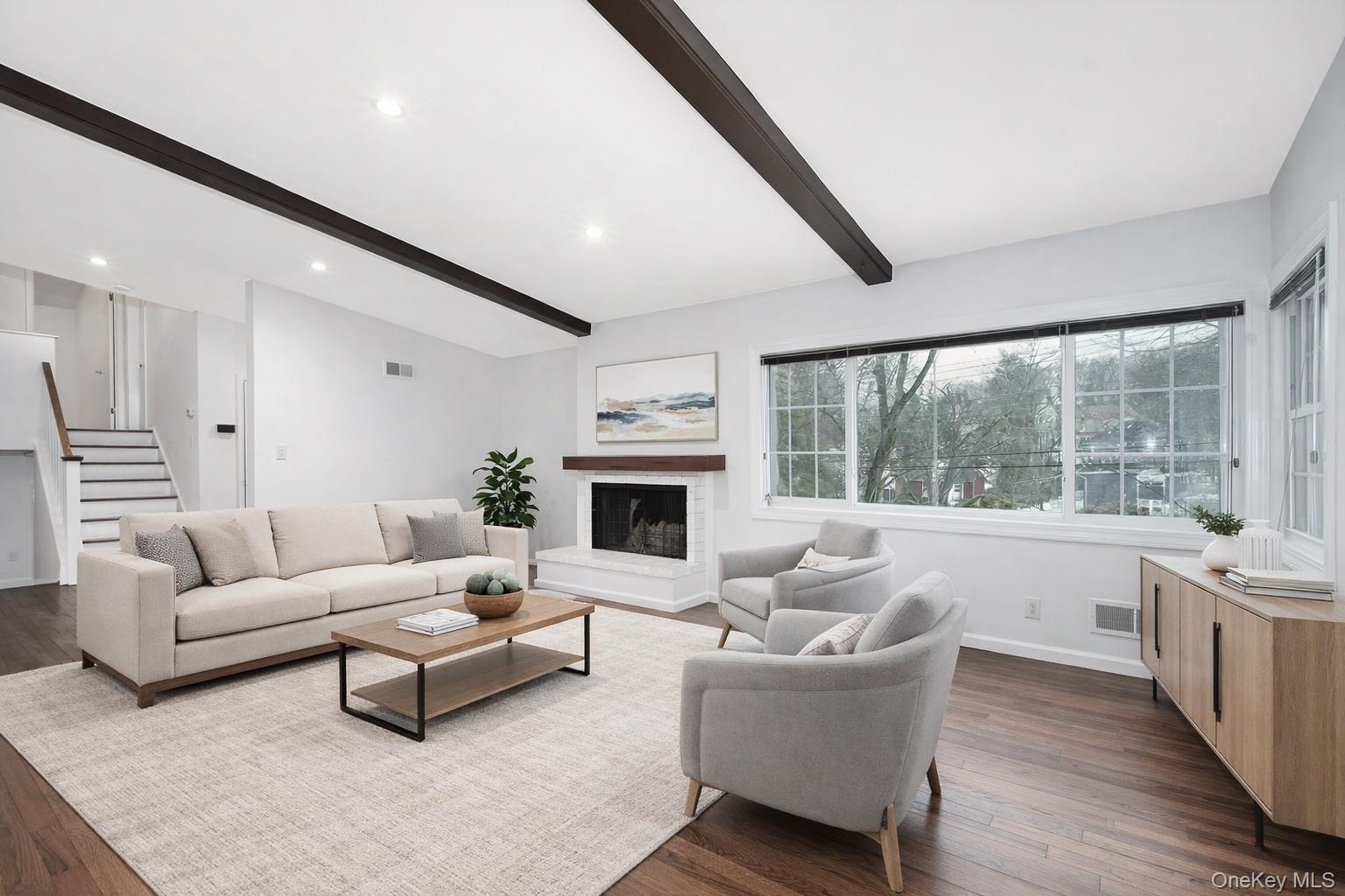 415 Pinebrook Boulevard New Rochelle, NY 10804 - Photo 5 of 20 a living room with furniture large window and a fireplace