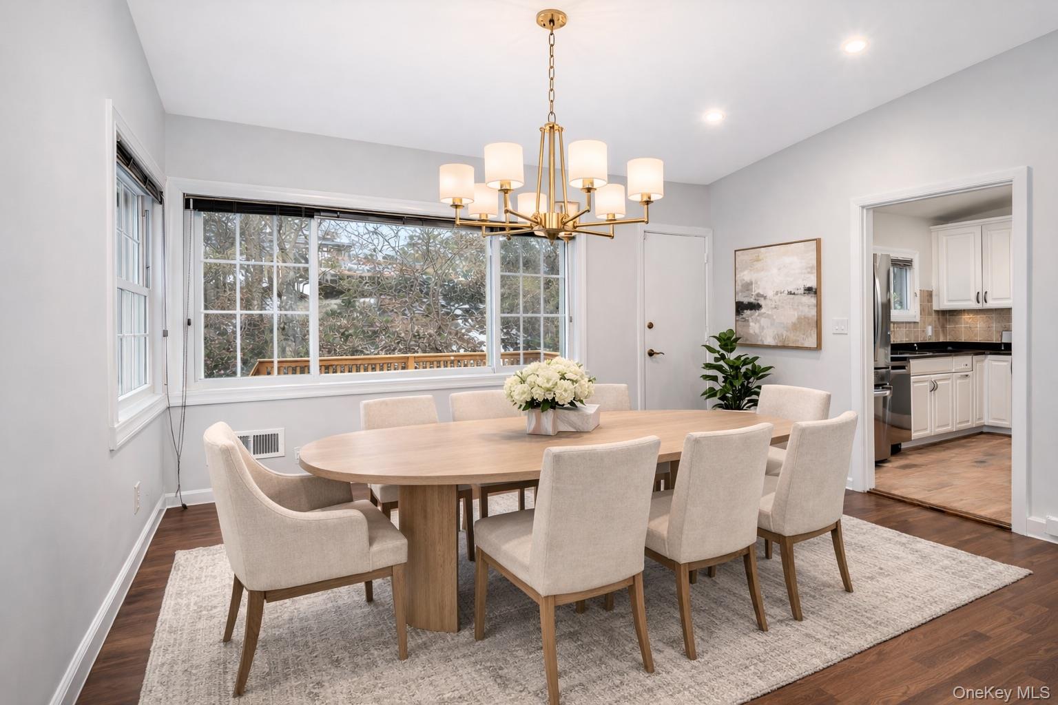 415 Pinebrook Boulevard New Rochelle, NY 10804 - Photo 6 of 20 a dining room with furniture a chandelier and wooden floor