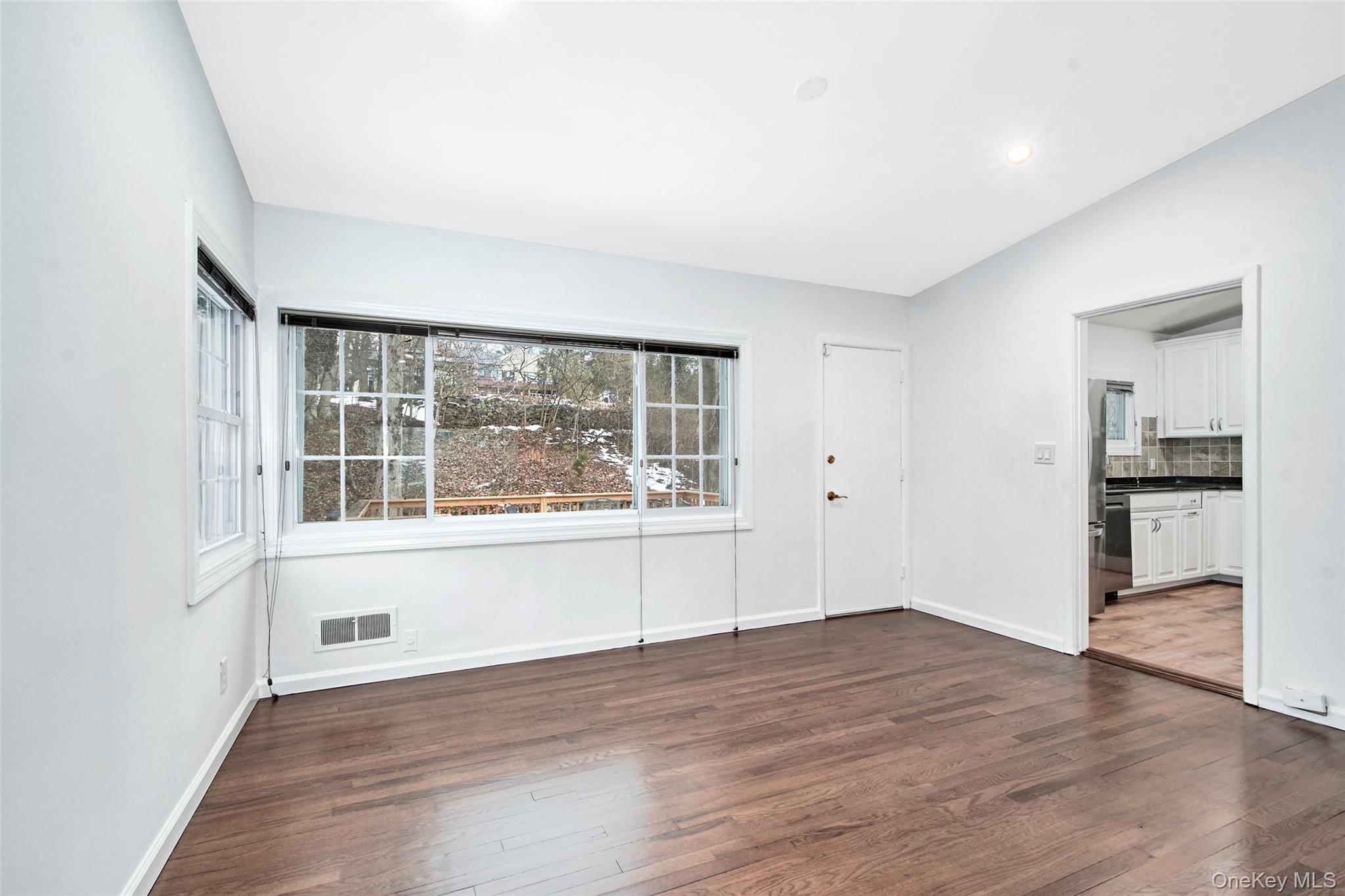 415 Pinebrook Boulevard New Rochelle, NY 10804 - Photo 7 of 20 wooden floor in an empty room with a window