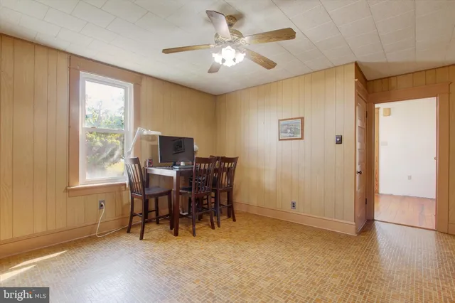 a view of a livingroom with furniture and a window