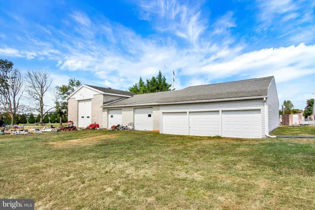 a view of a house with a yard and garage