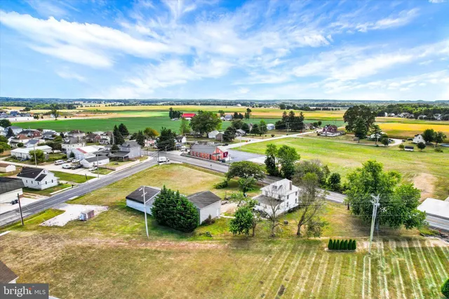 a view of swimming pool with outdoor seating and plants