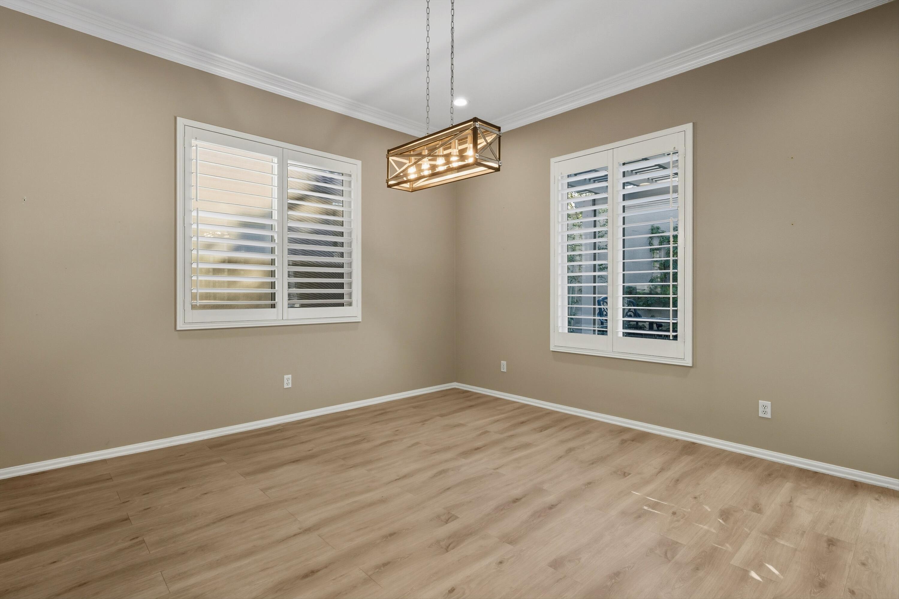 49465 Lewis Road Indio, CA 92201 - Photo 15 of 31 a view of an empty room with wooden floor and a window