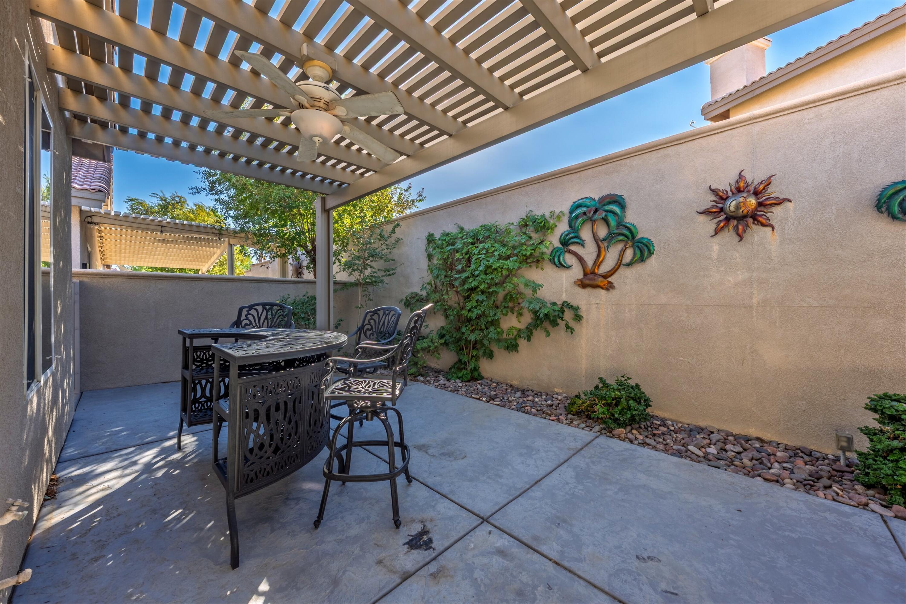 49465 Lewis Road Indio, CA 92201 - Photo 16 of 31 a patio with table and chairs with potted plants