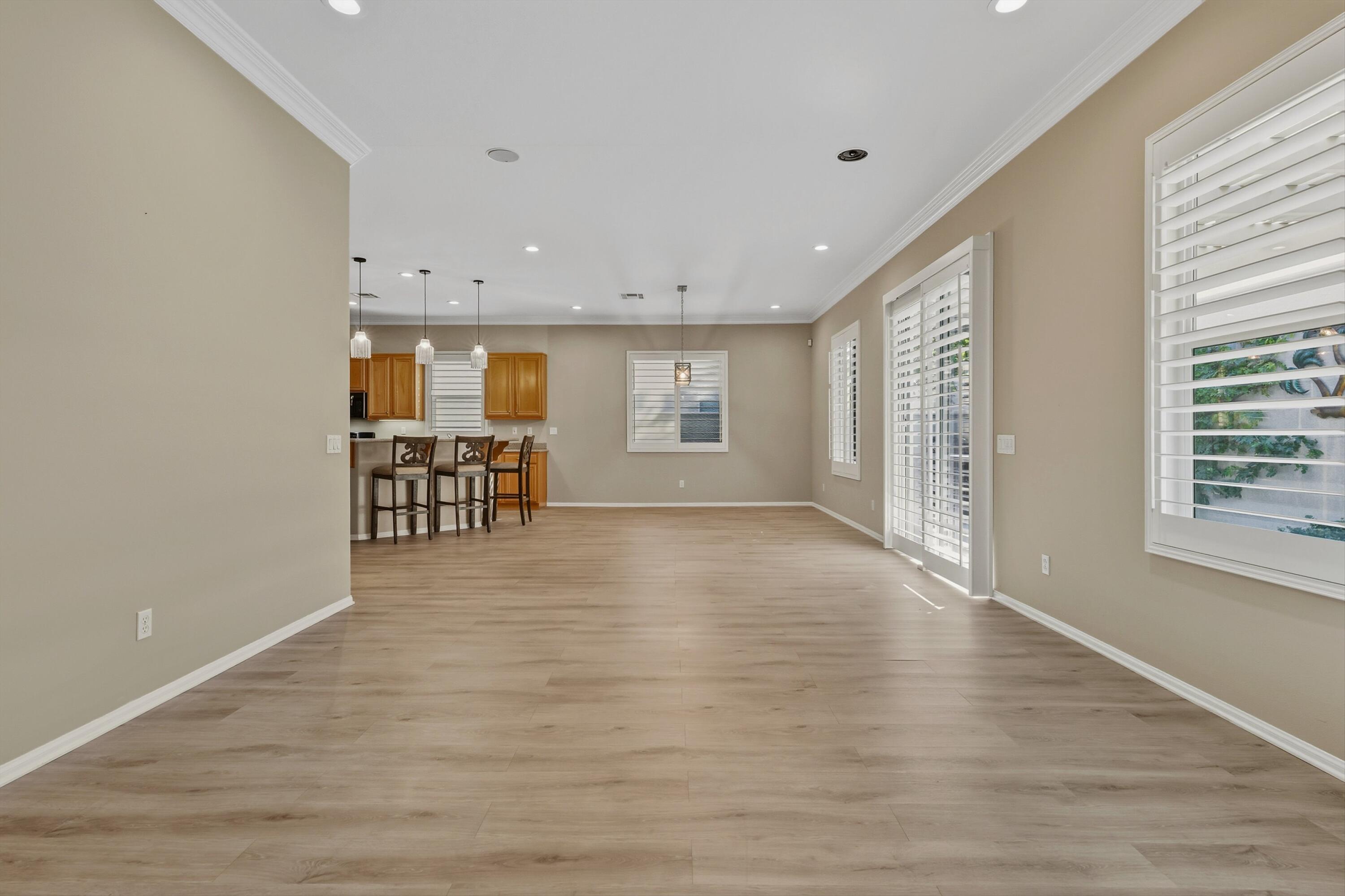49465 Lewis Road Indio, CA 92201 - Photo 18 of 31 a view of an empty room with a window and wooden floor