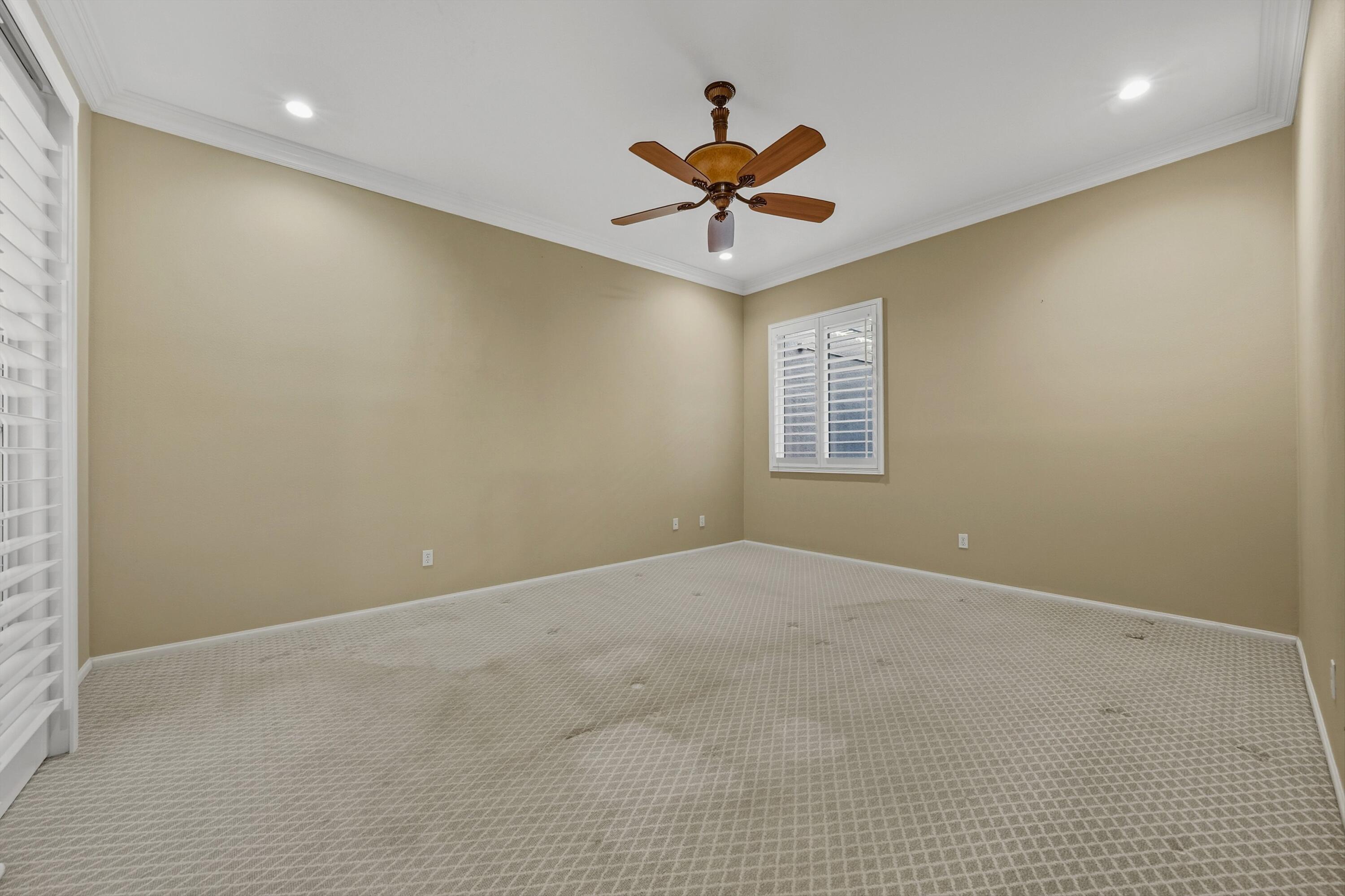 49465 Lewis Road Indio, CA 92201 - Photo 20 of 31 an empty room with a window and a fan