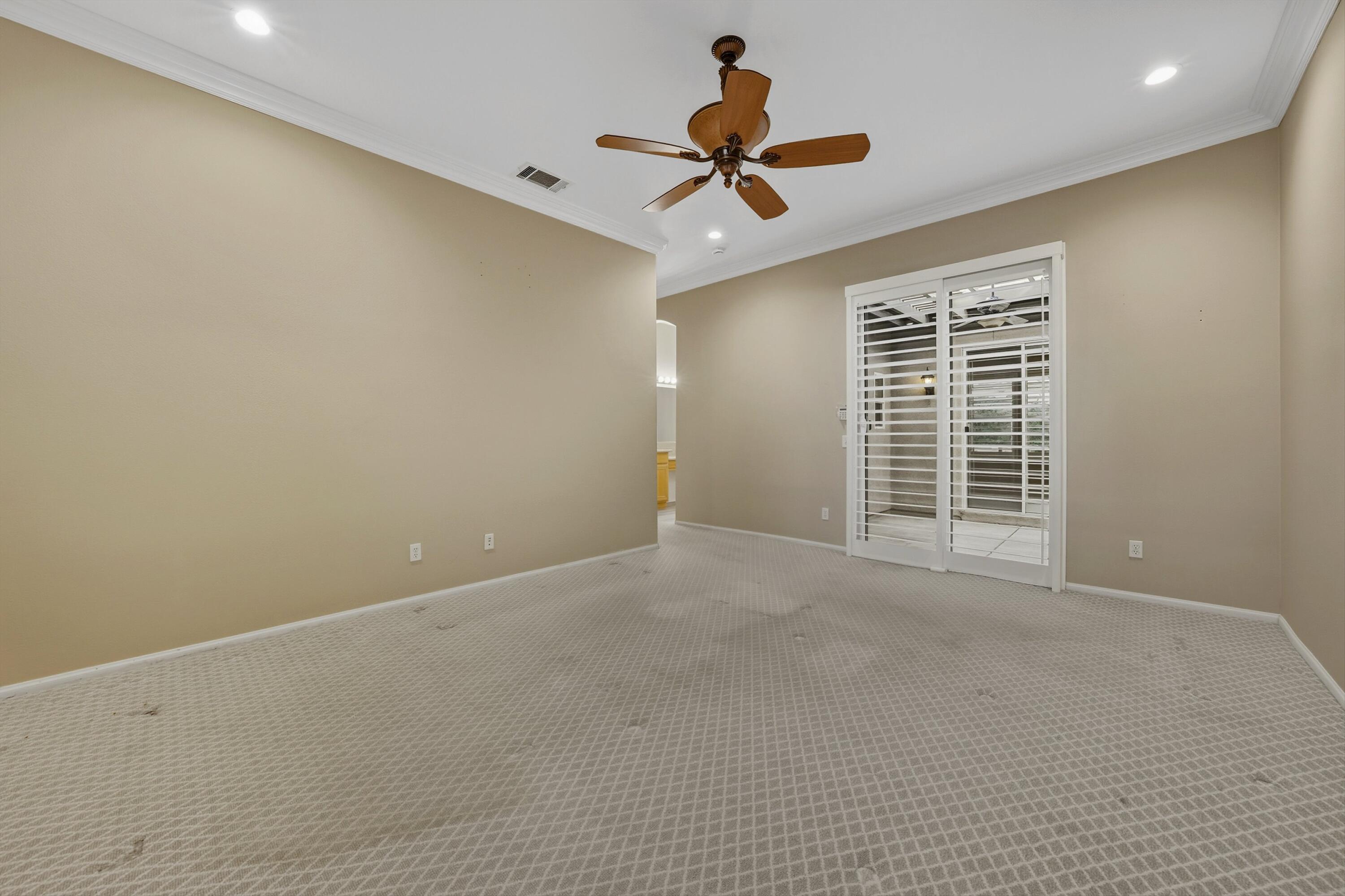 49465 Lewis Road Indio, CA 92201 - Photo 21 of 31 a view of a livingroom with a ceiling fan and window