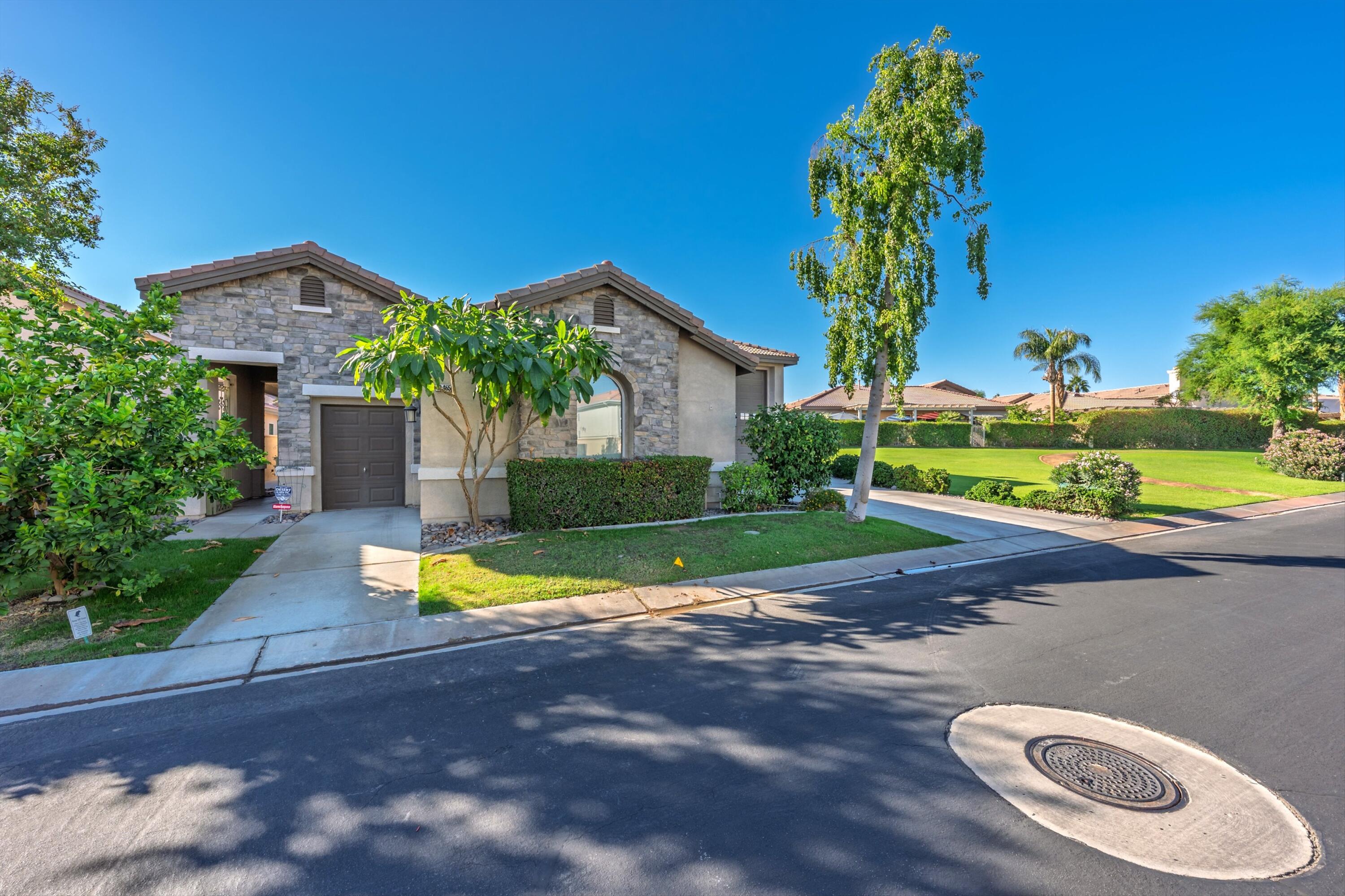49465 Lewis Road Indio, CA 92201 - Photo 3 of 31 a view of a house with a yard and street view