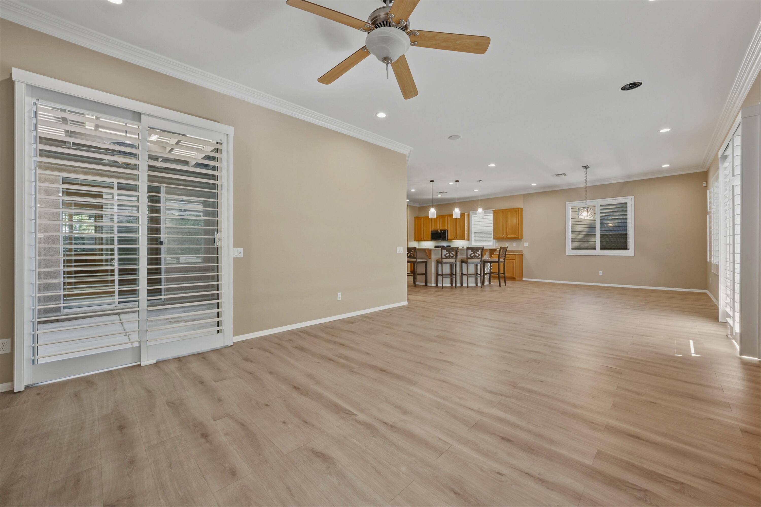 49465 Lewis Road Indio, CA 92201 - Photo 10 of 31 a view of empty room with wooden floor and fan