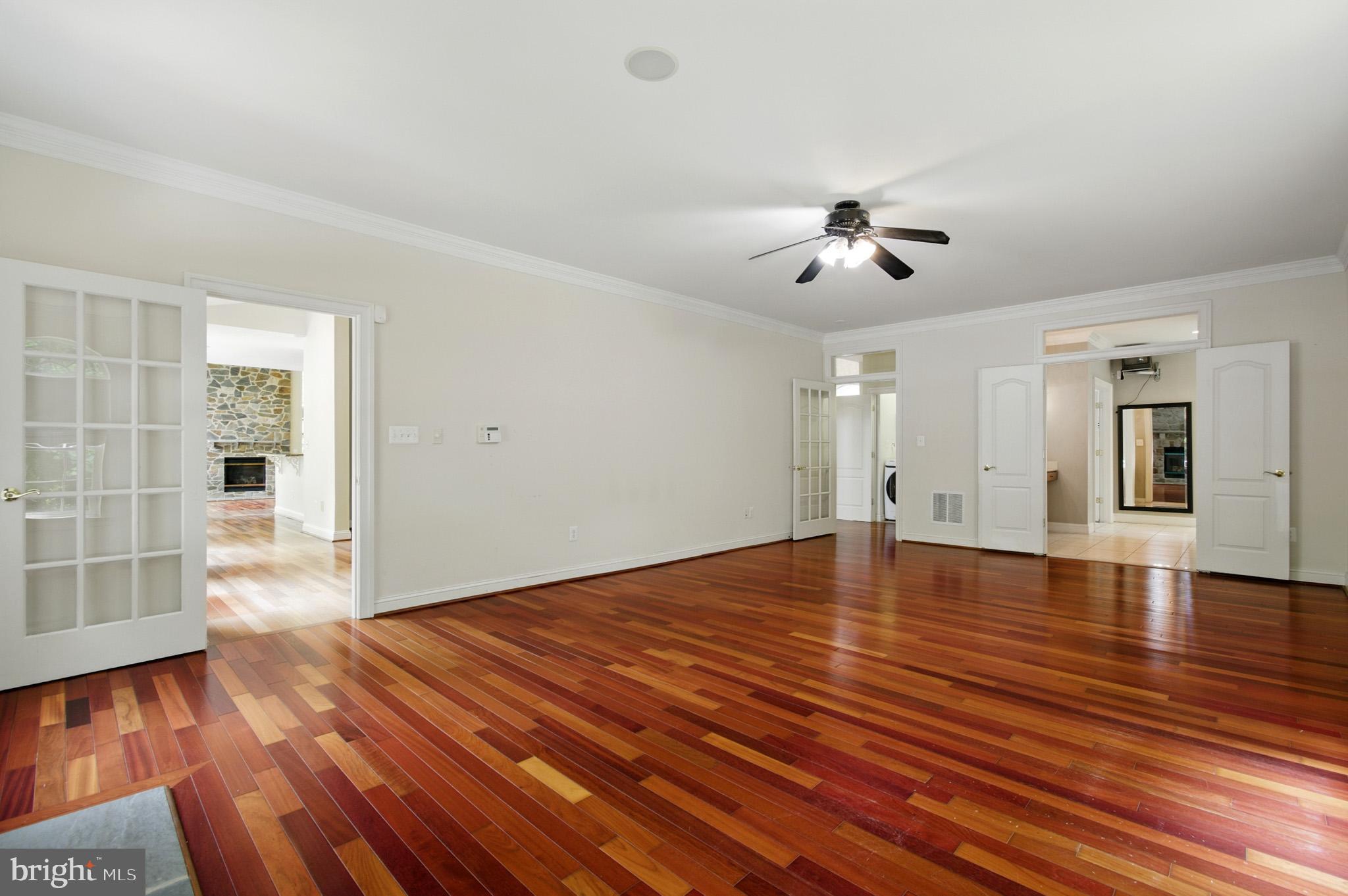 1002 Covington Way Annapolis, MD 21401 - Photo 19 of 78 a view of empty room with wooden floor and fan