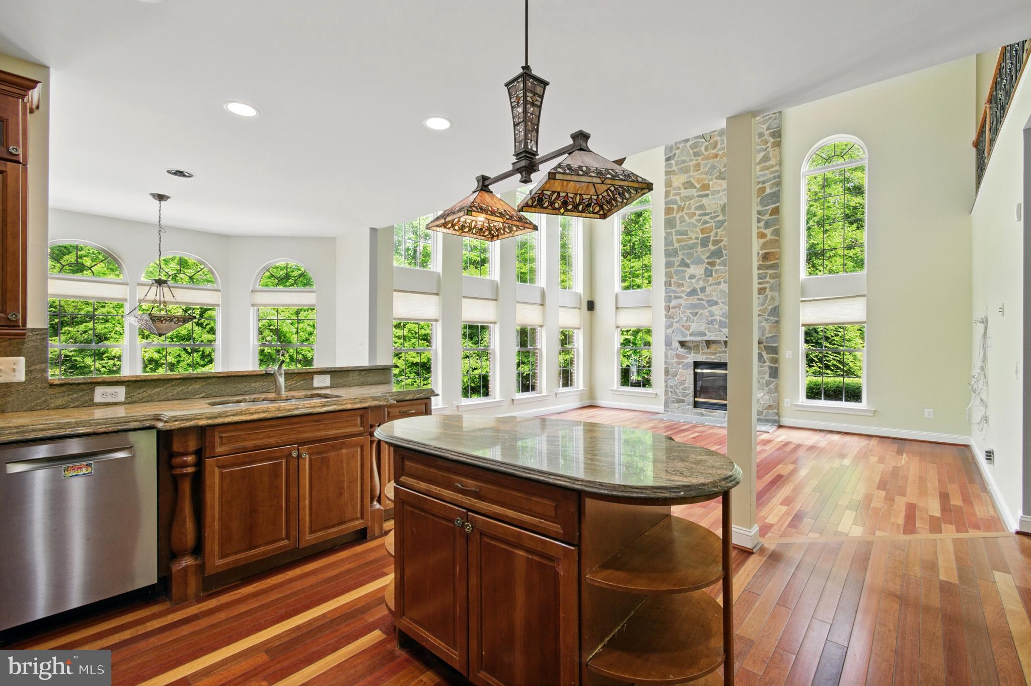 1002 Covington Way Annapolis, MD 21401 - Photo 28 of 78 a kitchen with a stove a sink and windows