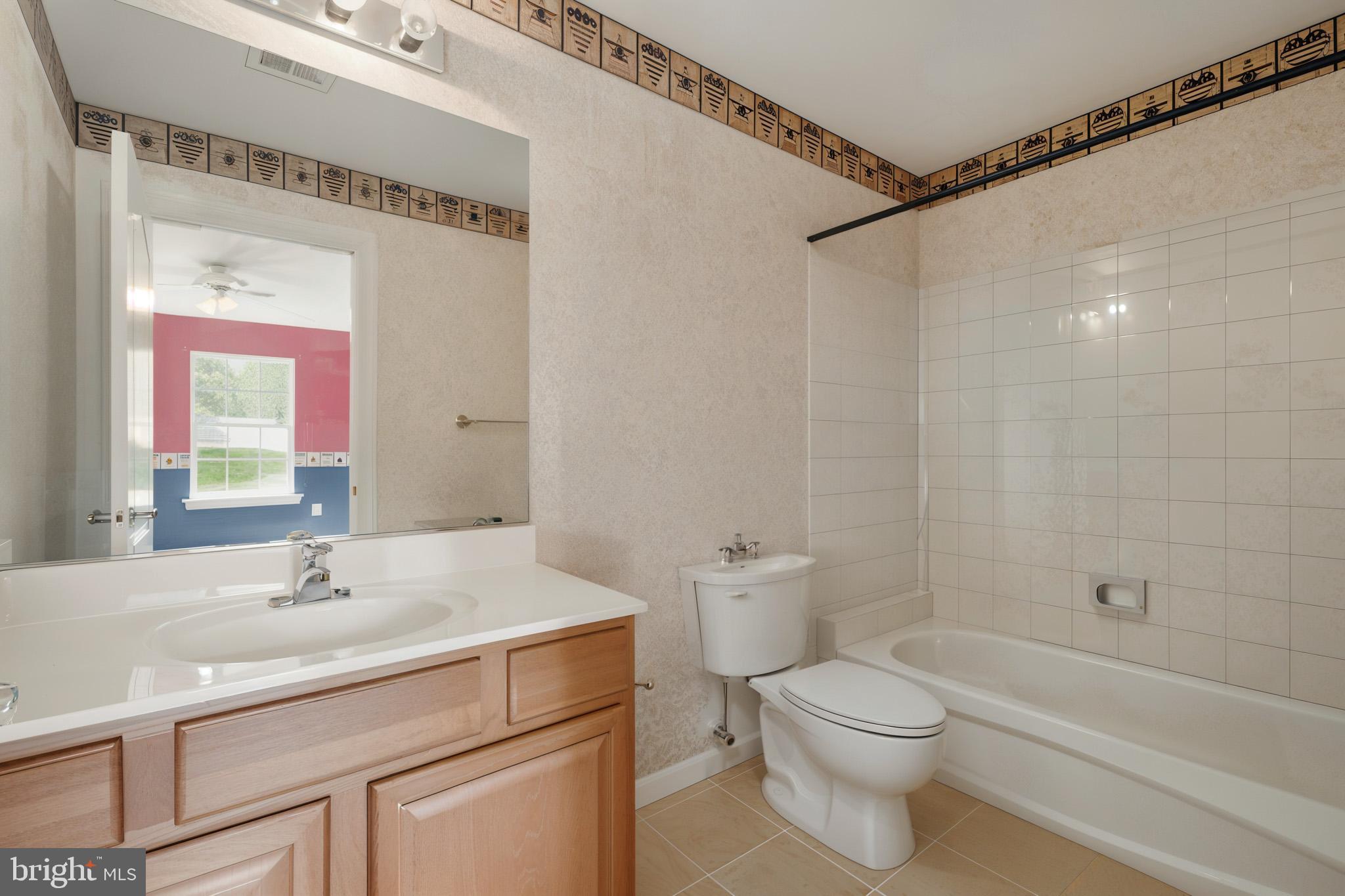1002 Covington Way Annapolis, MD 21401 - Photo 41 of 78 a bathroom with a sink a toilet and shower