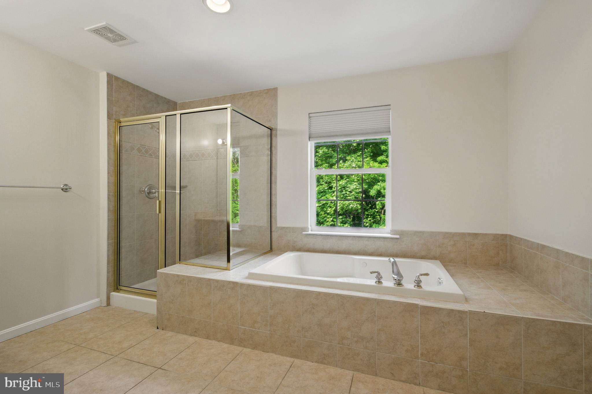 1002 Covington Way Annapolis, MD 21401 - Photo 46 of 78 a bathroom with a tub and shower