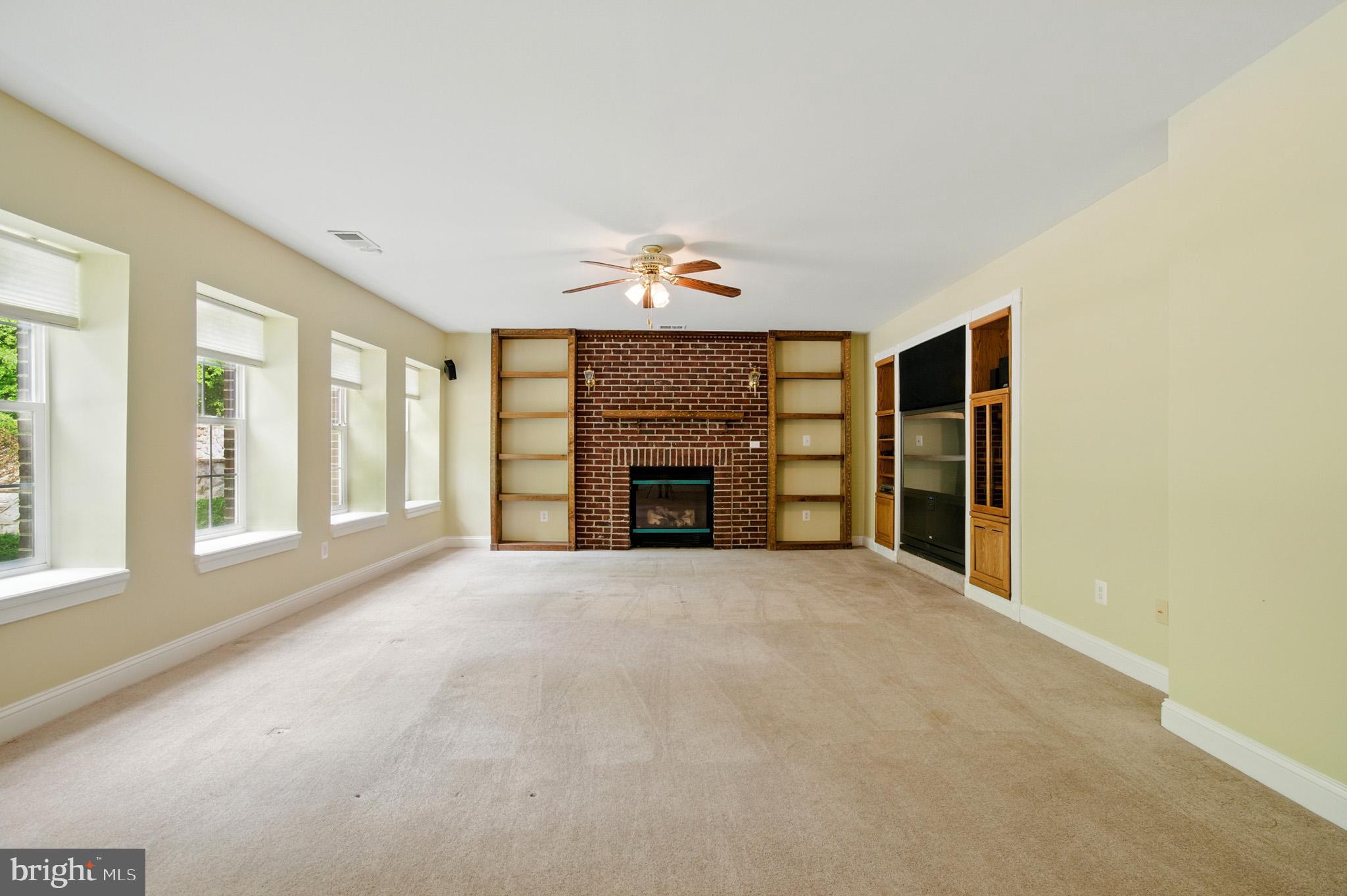 1002 Covington Way Annapolis, MD 21401 - Photo 61 of 78 a big room with windows and fireplace