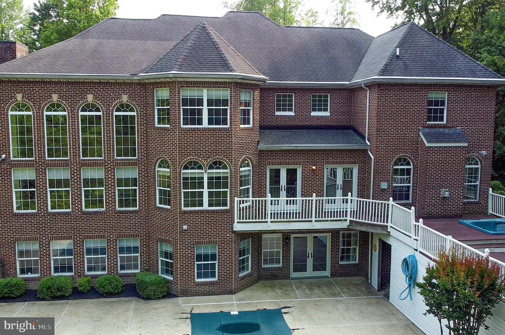 1002 Covington Way Annapolis, MD 21401 - Photo 72 of 78 a front view of a residential apartment building with a yard