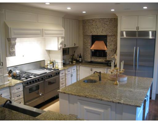10 Ivy Road Wellesley, MA 02482 - Photo 4 of 5 a kitchen with stainless steel appliances granite countertop a sink stove and refrigerator