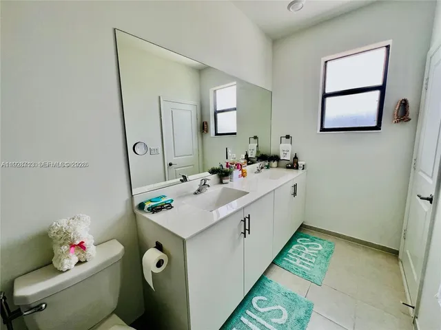 a utility room with a sink washer and dryer