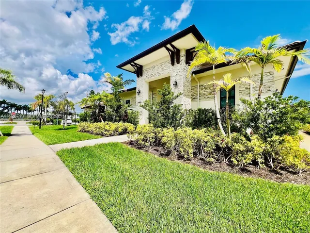 a front view of a house with garden