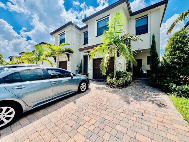 a view of a car parked in front of a building