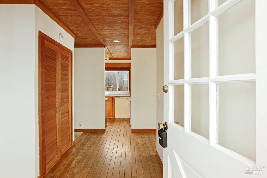 34 Sandy Beach Road Vallejo, CA 94590 - Photo 16 of 63 a view of hallway with wooden floor and furniture