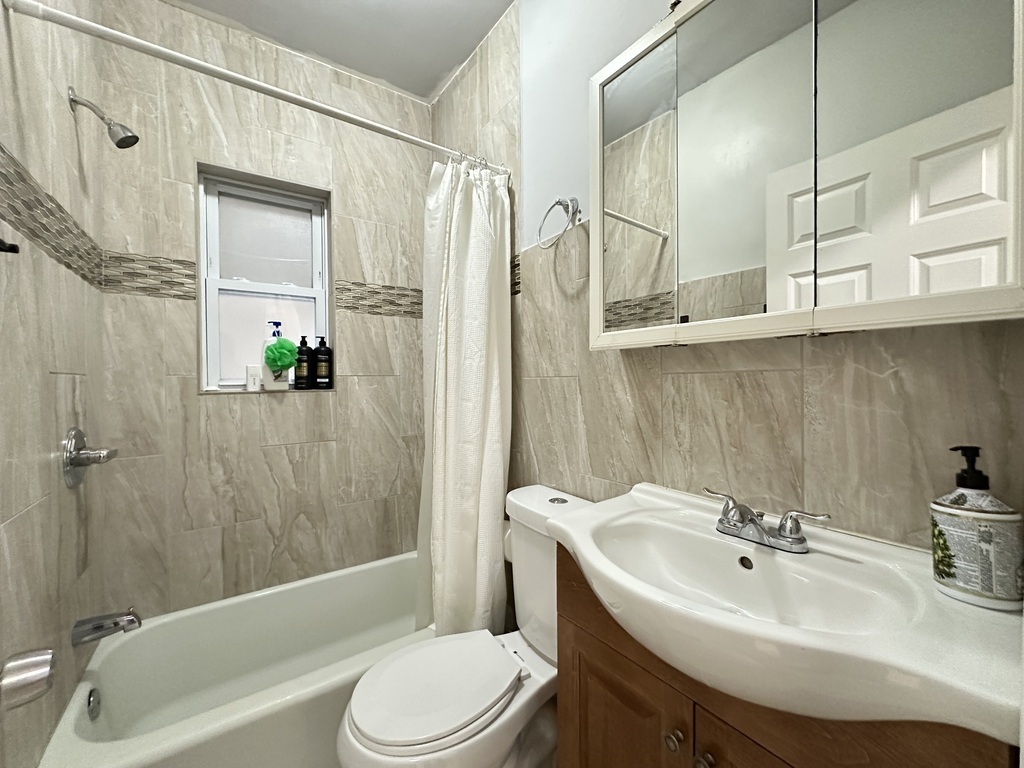 720 North Elizabeth Street, Unit 1 Chicago, IL 60642 - Photo 18 of 20 a bathroom with a sink toilet and shower