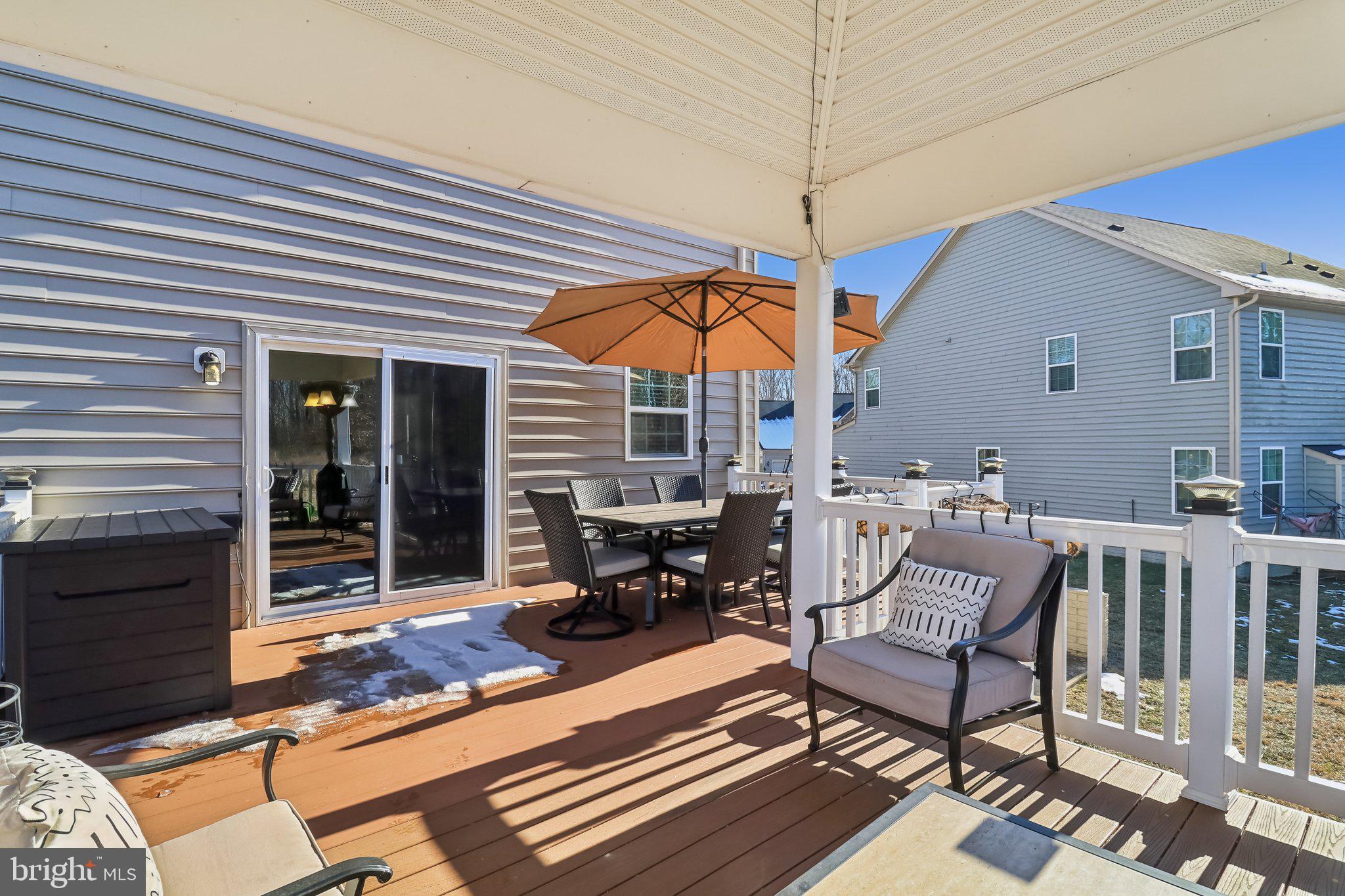 14013 Wheel Wright Place Accokeek, MD 20607 - Photo 33 of 38 a outdoor space with patio the couches and a fireplace