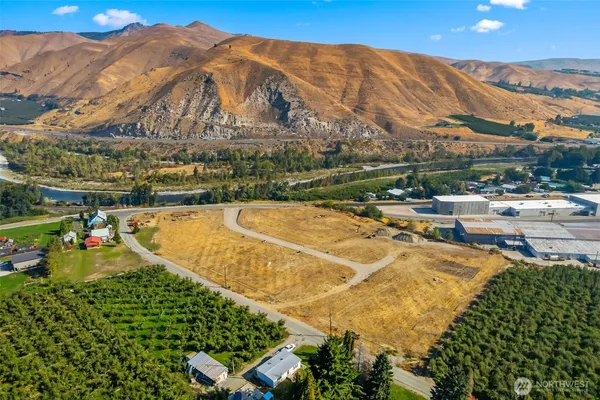 a view of a swimming pool with a table and chairs