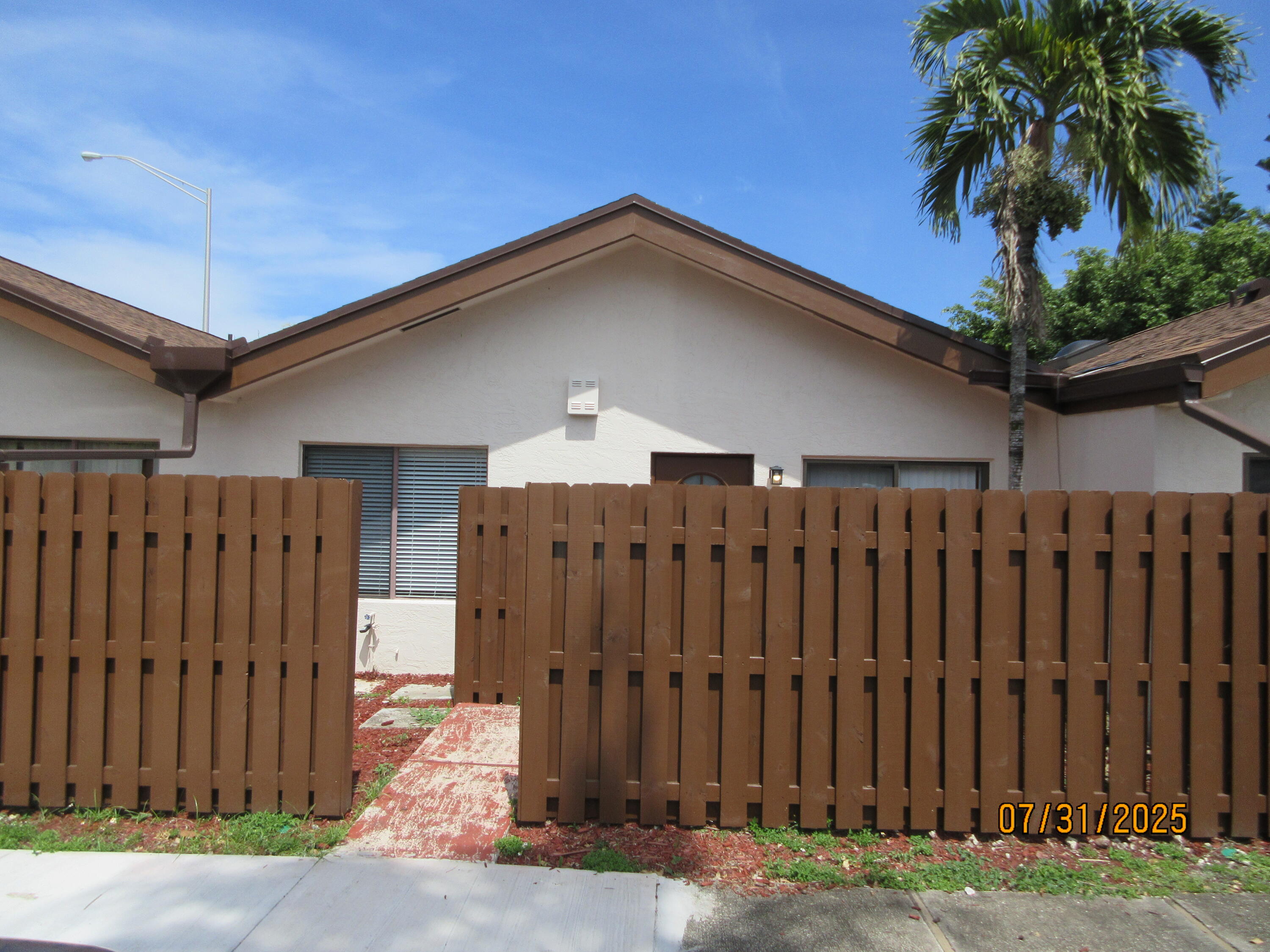 1760 Northwest 72nd Avenue, Unit 81 Plantation, FL 33313 - Photo 2 of 10 a view of a house with a backyard