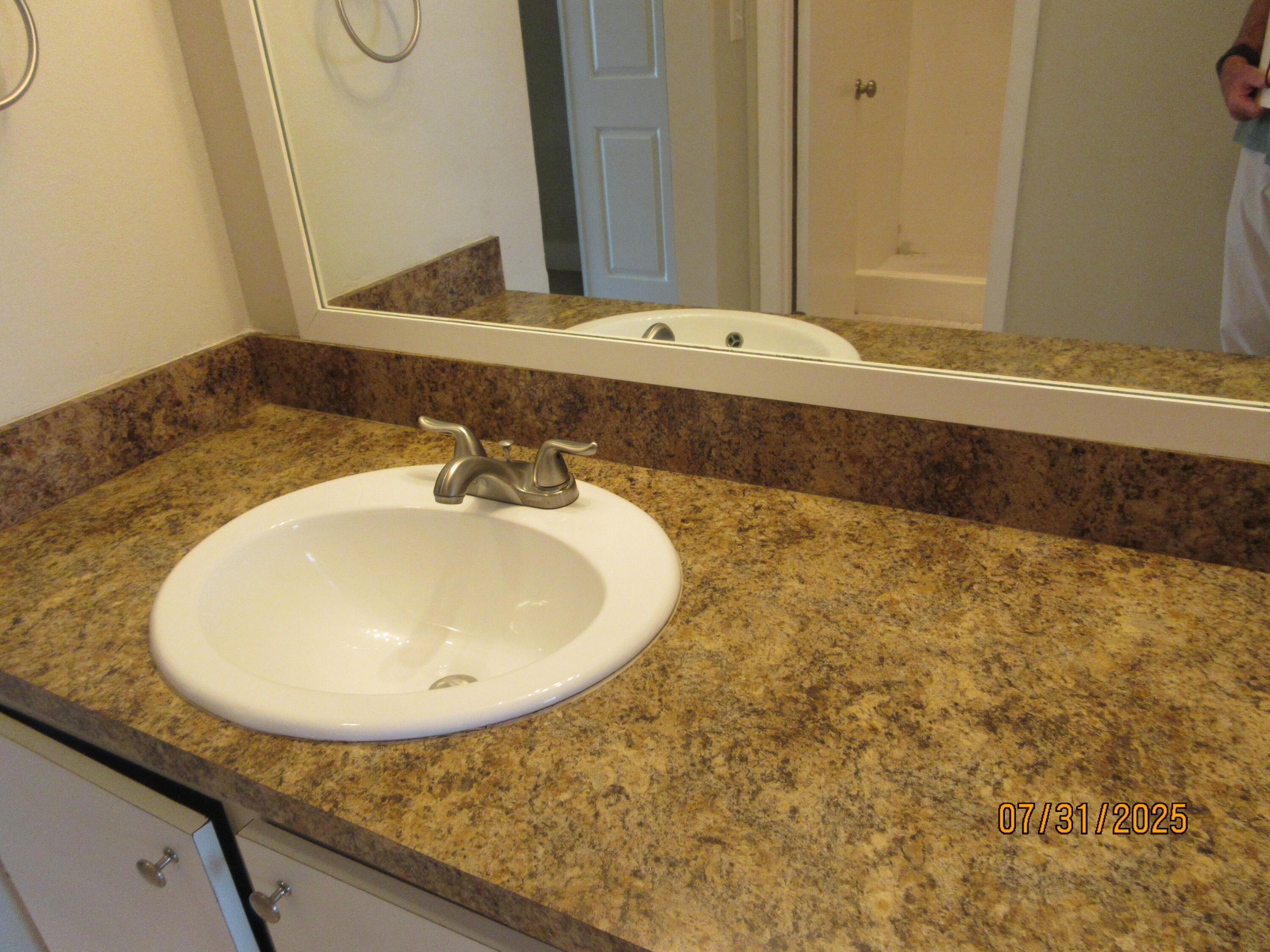 1760 Northwest 72nd Avenue, Unit 81 Plantation, FL 33313 - Photo 7 of 10 a bathroom with a sink and a mirror