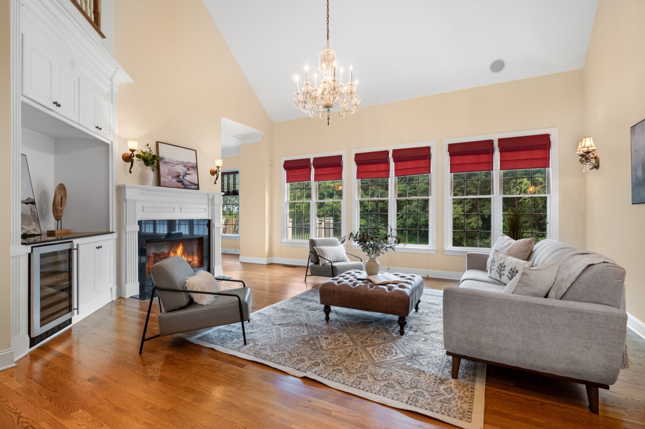 424 Sandcastle Road Franklin, TN 37069 - Photo 28 of 62 a living room with furniture a fireplace and a chandelier