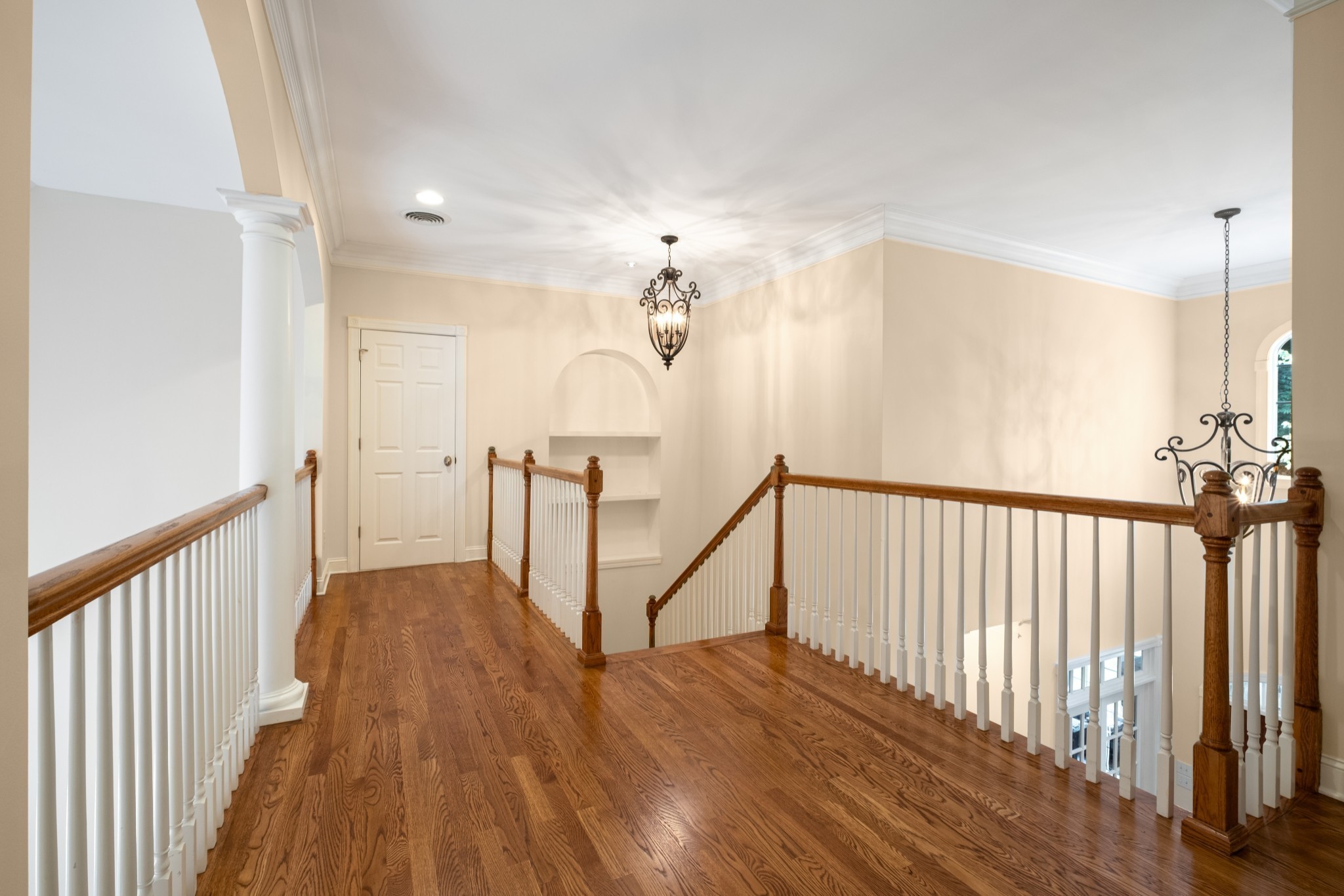 424 Sandcastle Road Franklin, TN 37069 - Photo 38 of 62 a view of a hallway with wooden floor and staircase