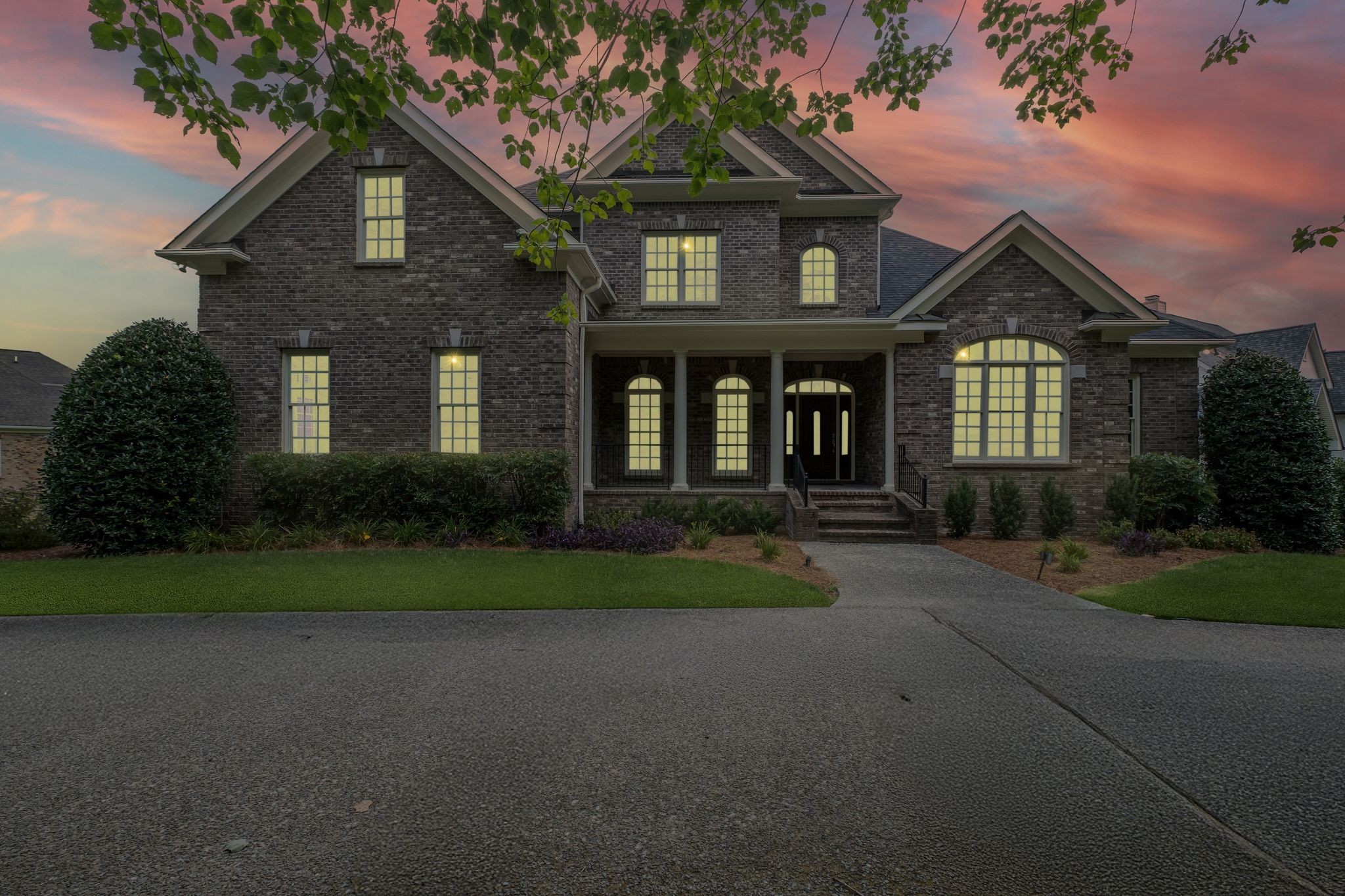 424 Sandcastle Road Franklin, TN 37069 - Photo 6 of 62 a front view of a house with garden