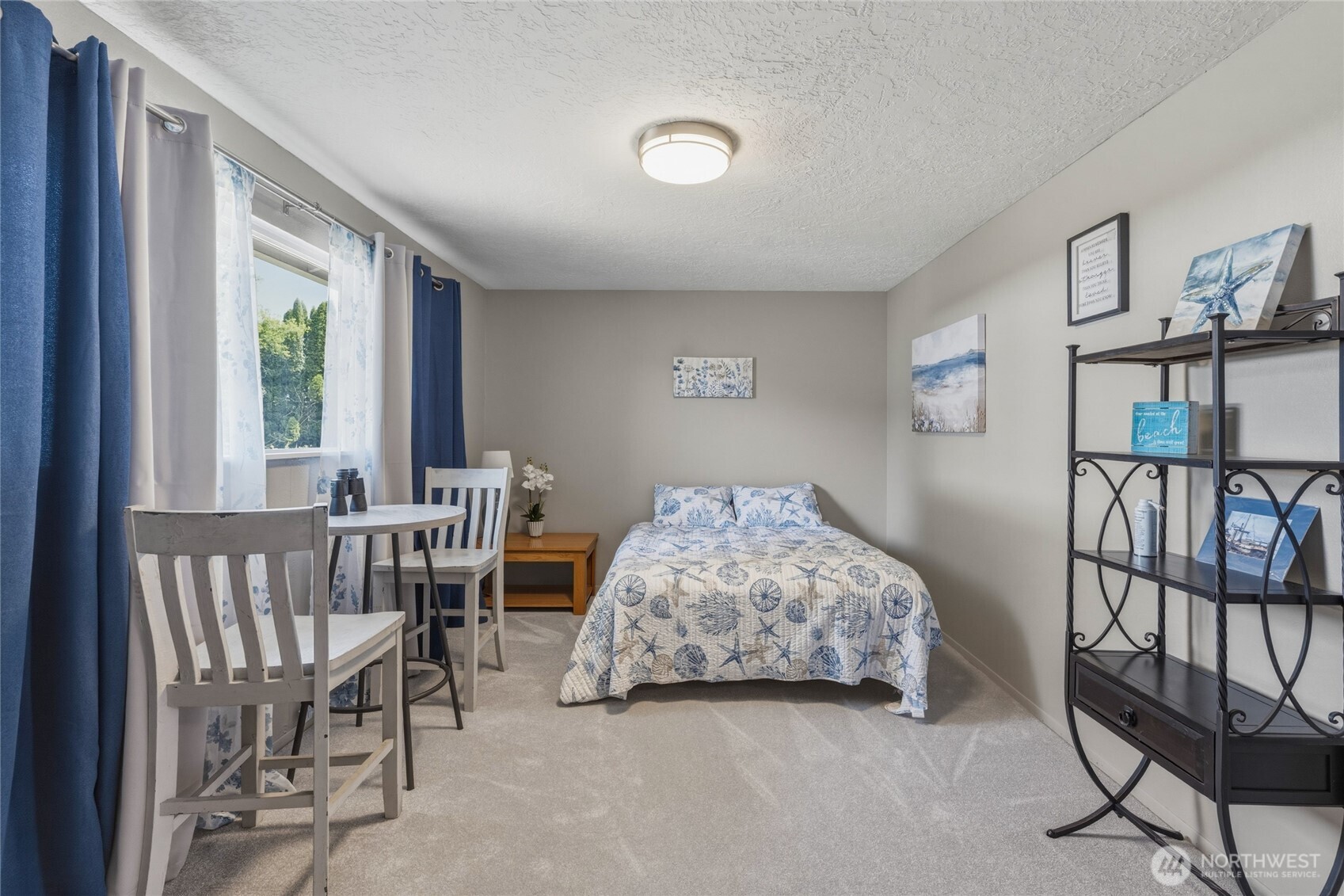 369 East Birnie Slough Road Cathlamet, WA 98612 - Photo 14 of 31 a bedroom with furniture and a window