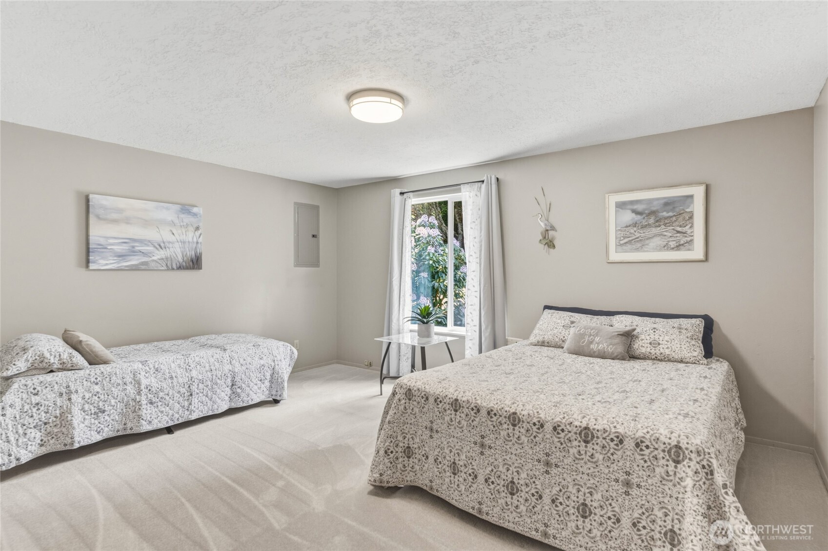 369 East Birnie Slough Road Cathlamet, WA 98612 - Photo 16 of 31 a bedroom with a large bed and a window