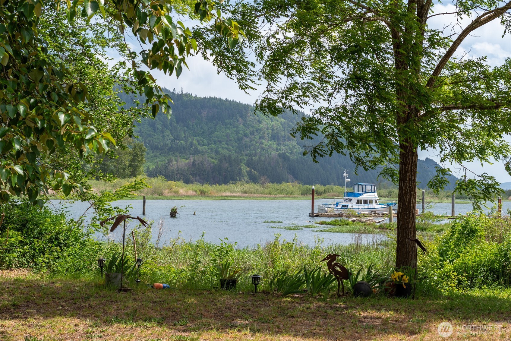 369 East Birnie Slough Road Cathlamet, WA 98612 - Photo 2 of 31 a view of a lake with outdoor space