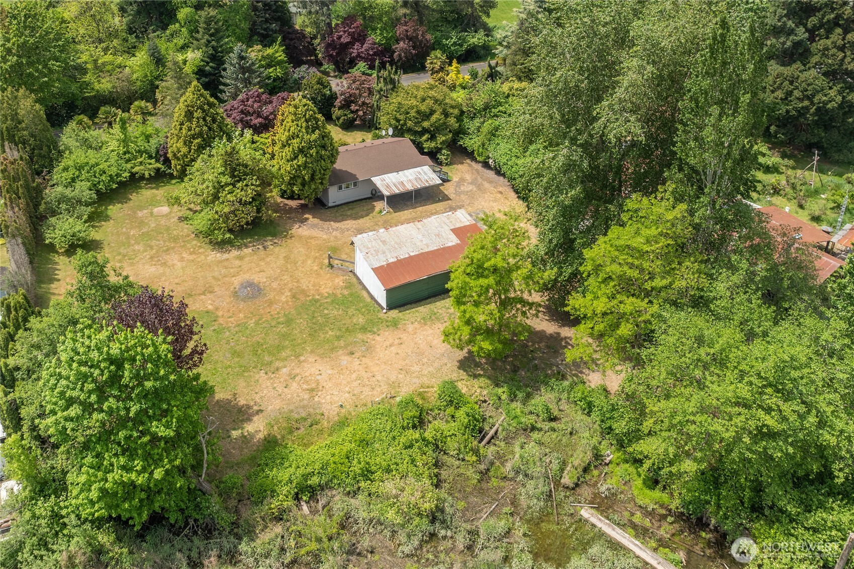 369 East Birnie Slough Road Cathlamet, WA 98612 - Photo 22 of 31 an aerial view of residential house with outdoor space and trees all around