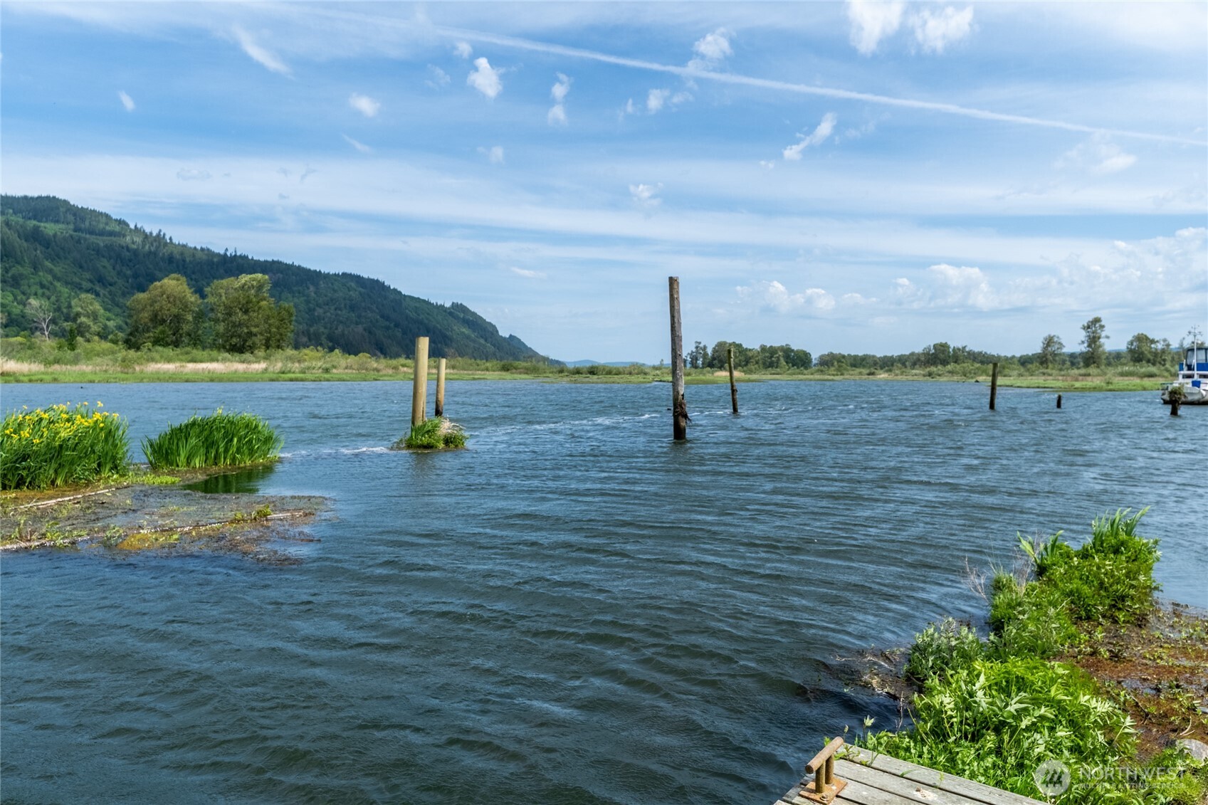 369 East Birnie Slough Road Cathlamet, WA 98612 - Photo 25 of 31 a view of a lake with a yard
