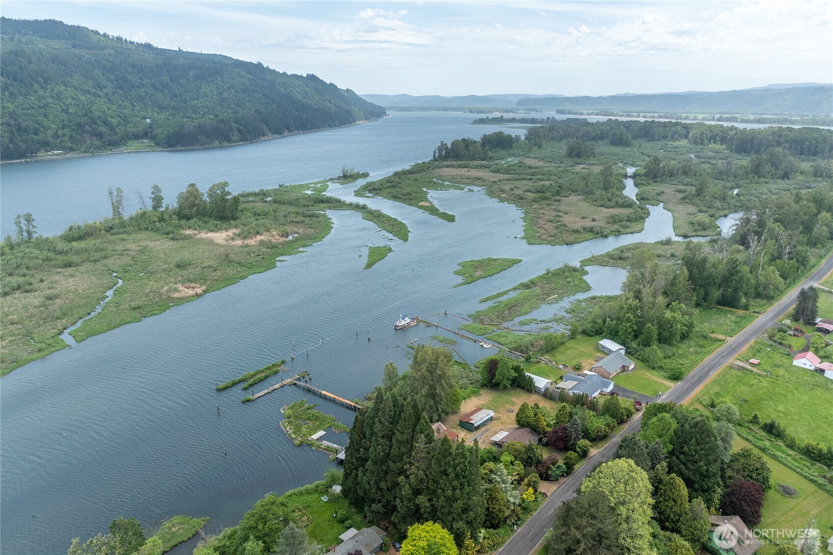 369 East Birnie Slough Road Cathlamet, WA 98612 - Photo 29 of 31 an aerial view of a house with a yard